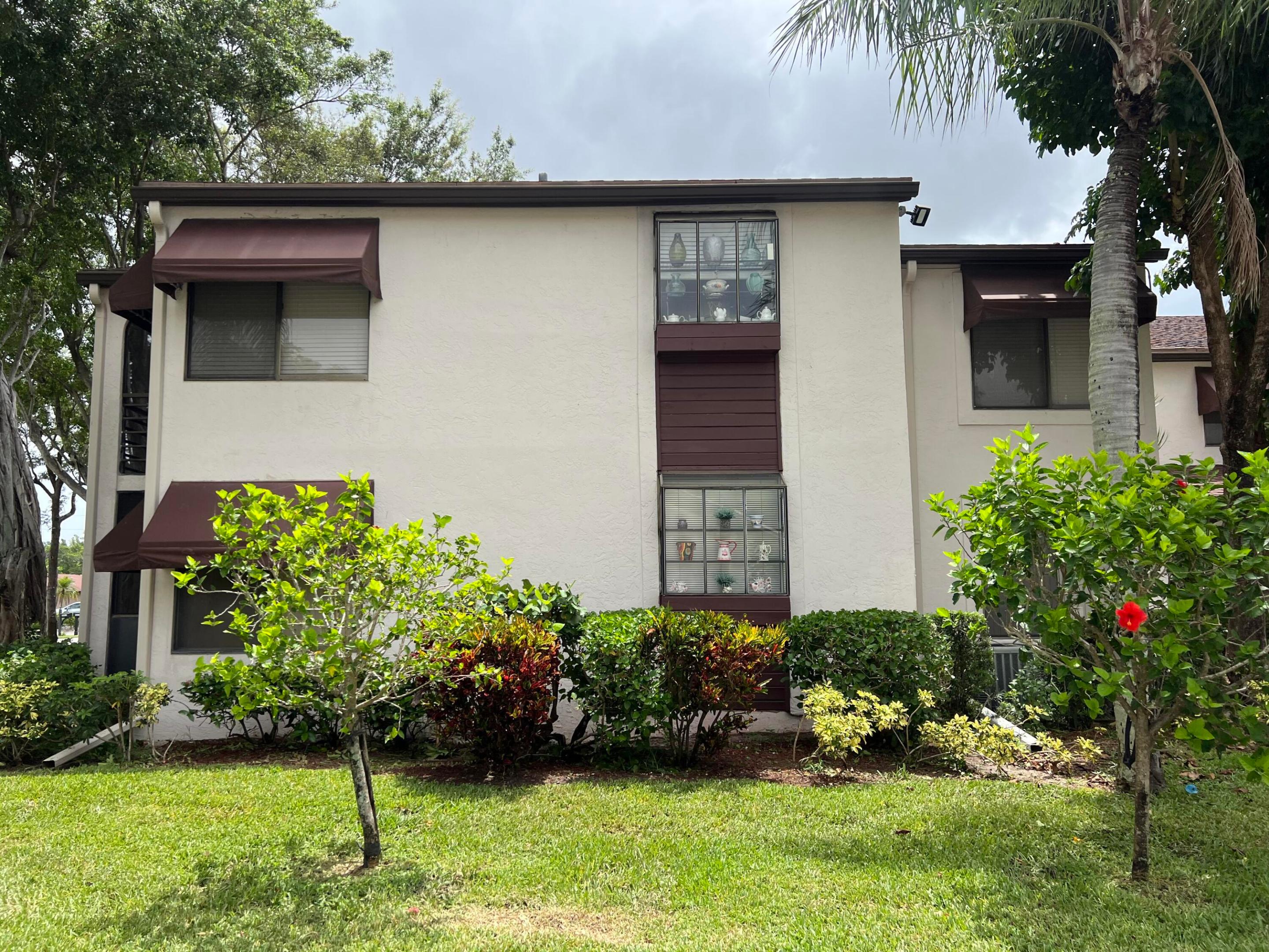 Welcome to this spacious first-floor residence in the desirable Rose Hill section of Boynton Beach 55+ Community,Offering over 1,100 square feet under air, This home presents an outstanding opportunity for buyers looking to make a home their own. The thoughtfully designed floor plan features generous living and dining areas, a large primary suite with abundant closet space, a spacious guest bedroom, and an inviting enclosed patio that provides additional living space to enjoy Florida's beautiful weather year-round.  While the home remains in its original condition and has not been updated, it has been well cared for and offers the perfect canvas for renovation, allowing the next owner to customize every detail to their own style and preferences. The solid layout, spacious rooms,  and desirable first-floor location create exceptional value in today's market.  55+ Residents enjoy beautifully maintained grounds and access to community amenities, all within close proximity to shopping, dining, golf courses, medical facilities, and everything Boynton Beach has to offer.  Whether you're searching for a seasonal retreat, year-round residence, or an investment opportunity, this home offers endless potential in an established and sought-after community. Don't miss your chance to transform this spacious residence into your dream Florida home.