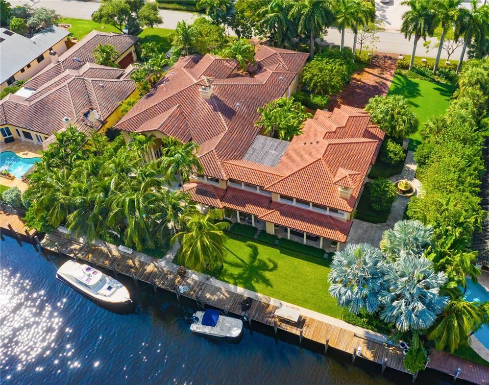 Unique mega-estate sits on approx 2/3 of an acre in 24-hour patrolled Seven Isles. 160 ft of deepwater might fit 100 ft yacht. The primary house features a two-story great room with a fireplace & walls of glass overlooking the pool. Impact glass, elevator, full house generator. Library equipped with a full bath. Upstairs master suite with sitting area, gym, and balcony. Two separate guest’s quarters presently used as HIS and HERS office. HIS Office features a full bath and closet. Her office includes sitting room, sink, two burners stove, full bath, & closet. Outdoor loggia includes four sitting areas plus a dining area next to a fully equipped outdoor kitchen and gas fireplace. Temperature-controlled wine cellar with 600 bottle capacity. Pool & Jacuzzi with waterfall and fire pits.