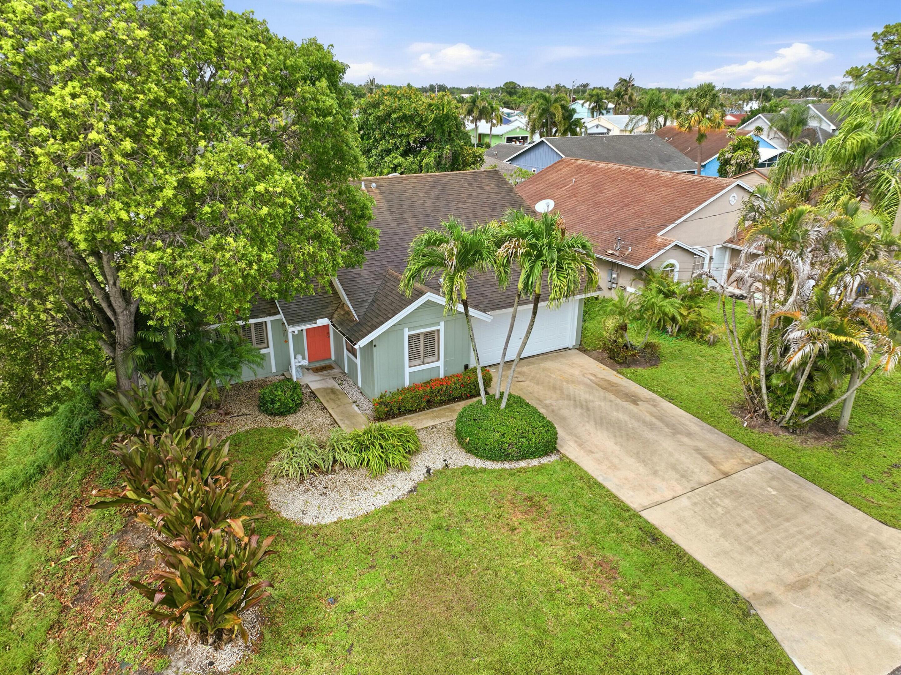 Welcome to this charming single-story pool home in North Palm Beach Heights, Jupiter. Offering 1,551 square feet, this three-bedroom, two-bathroom residence features vaulted ceilings that create a bright, open feel, a functional split-bedroom layout, and a two-car garage. Enjoy your private pool, perfect for relaxing or entertaining. Best of all, there's NO HOA. For added peace of mind, the roof will be replaced prior to closing. Conveniently located near top-rated schools, parks, shopping, dining, and Jupiter's beautiful beaches. Pool house in Jupiter in this area is not common. The sliding door to the pool has 3 openings 1- Master 2- Living/common 3 - Guest bedroom great option for Airbnb