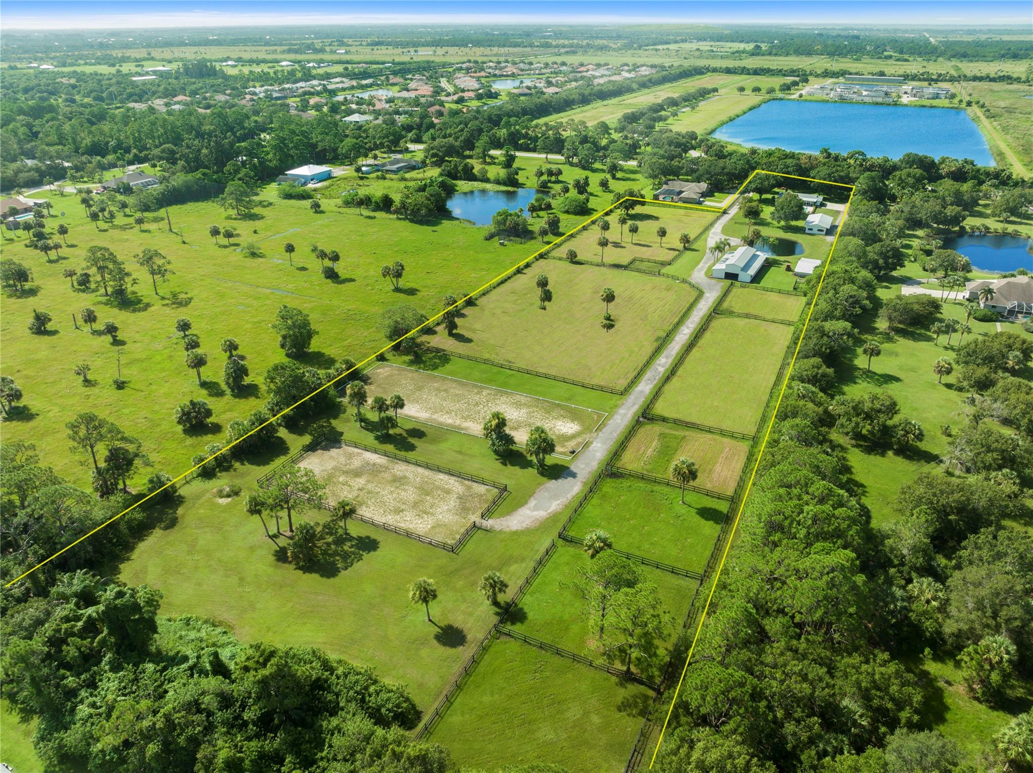 Exquisite equestrian estate on 8.63 acres. Adorned with mature oak trees. Updated 3/2 CBS home with heated pool & custom paver patio. Boasts new commercial LVT flooring throughout. Open kitchen w/stainless appliances. New roof 2022. New AC & water heater. 70x40 10 stall barn with feed & tack rooms. 65X25 5 stall barn with bathroom & garage space. 45x25 storage barn with 2 stalls that offer fans, auto-waterers & mats in each stall. Multiple turn-out paddocks with wood fencing. 195x65 dressage arena. 136x62 schooling arena. Paved road. County water. Conveniently located. A turn-key property!