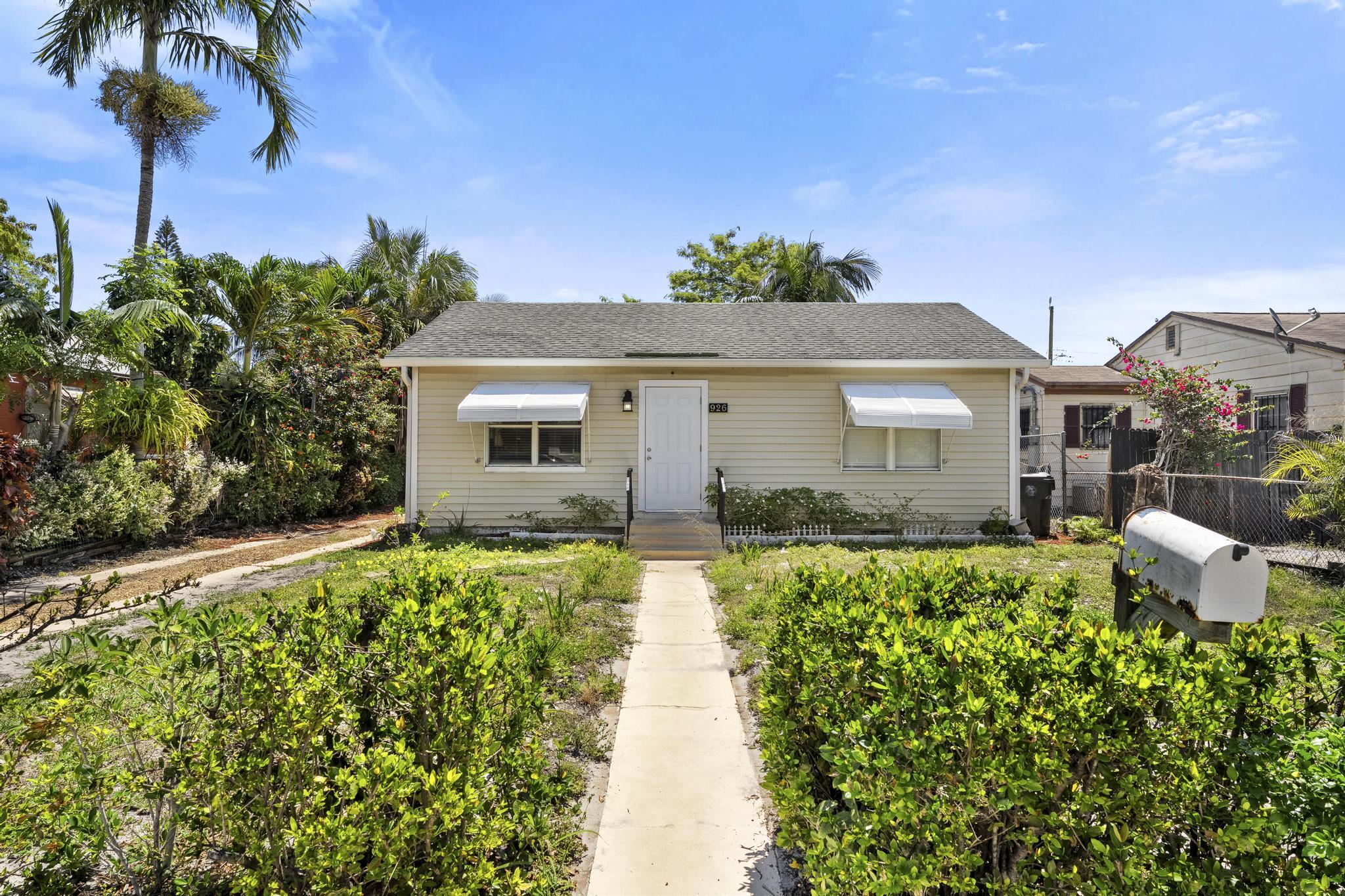 Charming 2-bedroom, 1-bath home with a spacious fenced backyard, beautiful fruit trees, and plenty of parking! This home is full of potential and offers a fantastic opportunity for first-time homebuyers, seasonal residents, or investors seeking a great rental property. Featuring an open floorplan gives the ability to add your personal touch to the main living area.  Tile flooring throughout, tons of natural light, and two generously sized bedrooms await.  Enjoy outdoor living with a large, private yard perfect for entertaining, pets, gardening, or relaxing under the mango trees.  No HOA means added flexibility and freedom. Ideally located just minutes from downtown Lake Worth, the beach, shopping, dining, and the airport, this property combines convenience, and solid investment potential in one affordable package.