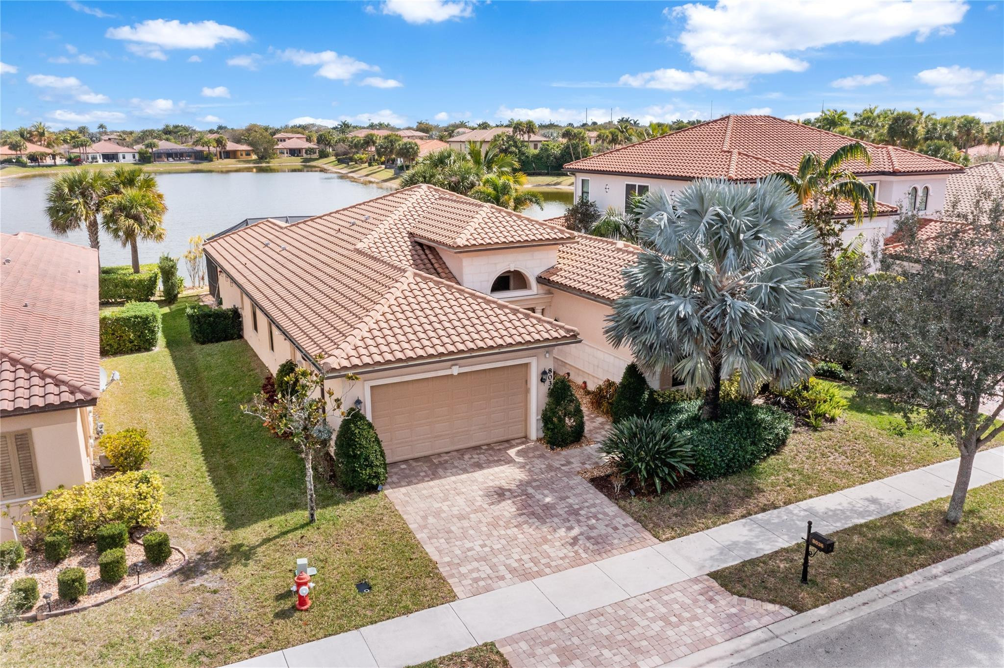 Enjoy True South Florida Living In This Lakefront Cottonwood Model With Den/Office, Ideally Situated In The Osprey Lake Section Of Heron Bay. Built In 2014, This Home Offers A Desirable Split Bedroom Floorplan & An Oversized Screened Paver Patio To Enjoy Gorgeous Water Views & Beautiful Sunrises. This Spectacular Home Features Lots Of Upgrades: Porcelain Tile, New Laminate Flooring Throughout All The Bedrooms,  SS KitchenAid Appliances Including A Double Oven And Gas Cooktop, Upgraded Backsplash, And Ample Cabinetry. Granite Countertops Are Featured Throughout The Home. Impact Windows & Doors. Walk To Heron Bay’s Main Clubhouse & Enjoy Access To Resort-Style Amenities Including Pools, Tennis & Basketball Courts, A State-Of-The-Art Fitness Center, & more. Low HOA. A-Rated Parkland Schools.