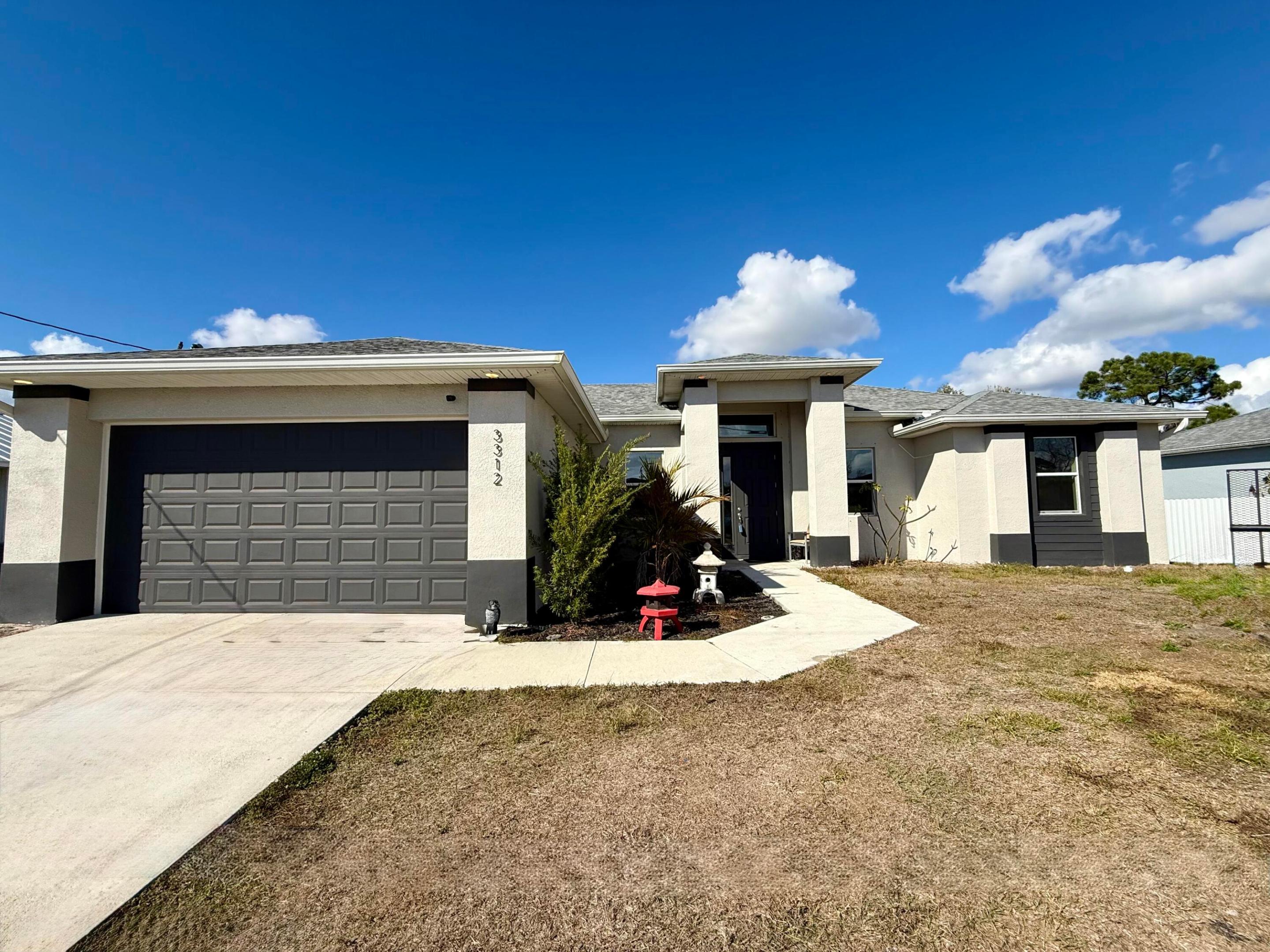 Welcome Home!!!This well maintained and beautiful home is located in the heart of Lehigh Acres! Built in 2022, offers 3 bedrooms + Den, 2 bath 2 car garage, it features over 1700 sq. ft. of living area with tile floors throughout for easy care, indoor laundry room, the spacious den/study that offers the perfect space for a fourth bedroom, a home office or playroom, an open floor plan that seamlessly connects living areas, making it ideal for entertaining or gatherings. The spacious and beautiful kitchen features an island with a pantry, Breakfast Bar and includes all appliances. The sliding doors lead out to the outside to enjoy the open Lanai overlooking the backyard where you'll have plenty of room for a pool!. Additional features include a new open-air Aerator and pressure tank. Conveniently located near schools, parks, shopping, and major roadways, this home is a must-see. Call today to schedule your private showing!