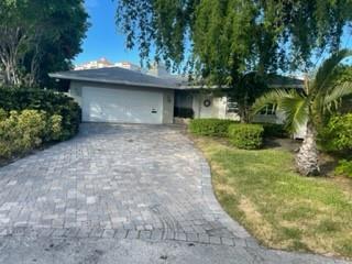 Extremely rare waterfront POINT LOT home in prestigious Coral Ridge neighborhood with over 185 feet of waterfront (125' on the intracoastal and 60' of side canal for private dock for your boat). Total lot size is over 1/4 of an acre and approximately 12,964 sf. The property is close to fine dining, shopping, the beach, and minutes to the ocean with no fixed bridges. The property is primed for redevelopment of a new home or remodel the existing home. The existing home is a 4 bedroom 4 bath, ranch style home with a pool on pilings. No wake zone directly behind property. Many new construction homes on the street. Information believed accurate but to be verified by Buyer. Property is being sold AS-IS.