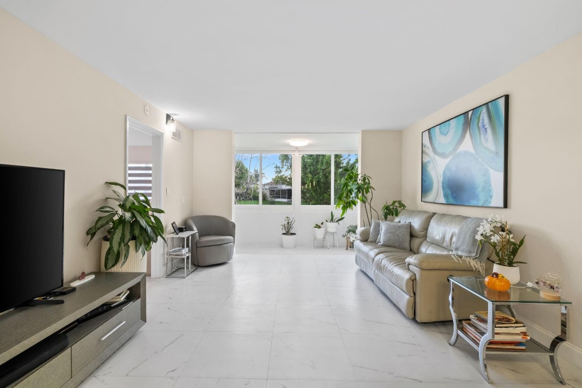 Easy to show!!! Beautiful, fully remodeled, featuring 2 spacious bedrooms and 2 modern bathrooms. 1st floor unit in the desirable Sunrise Lakes, 55+ community.  Move-in ready, new flooring, new kitchen, new bathrooms, 2025 AC,  and ALL IMPACT WINDOWS AND FRONT DOOR. This unit offers serene water view, bright living area, with resort-style amenities including golf, gym, pools, tennis and more!
