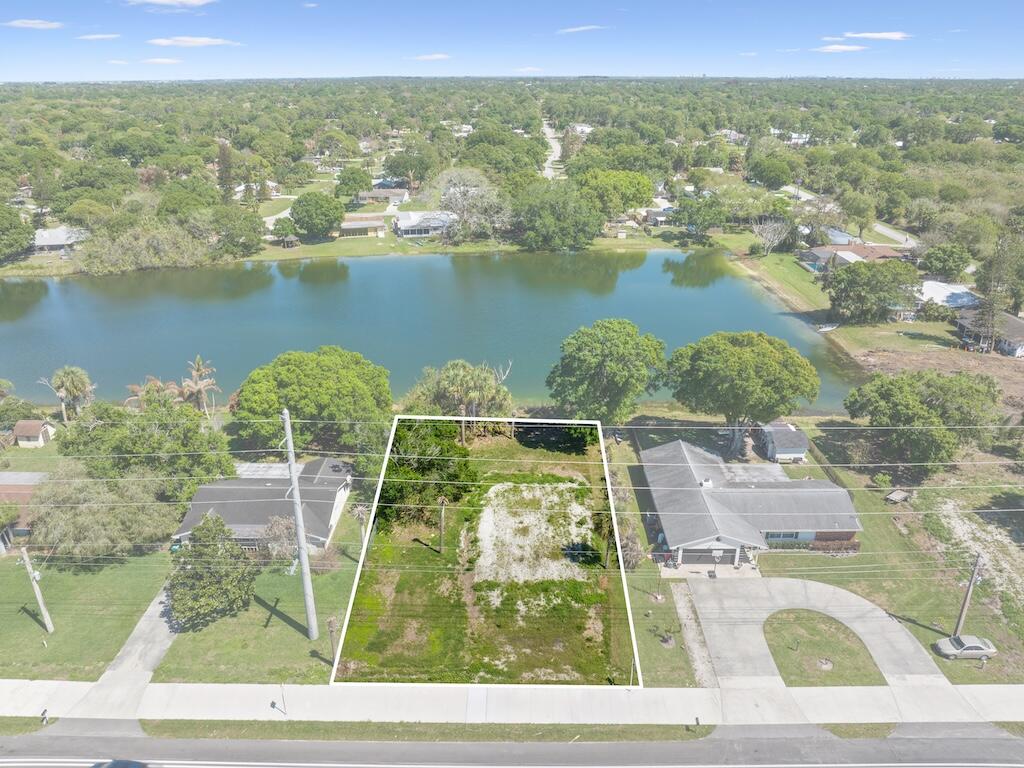 Build your Florida dream home on this oversized 0.26-acre lakeview homesite in the desirable Lakewood Park community. Already improved with a house pad in place, this property offers a valuable head start toward construction while maximizing picturesque water views. Enjoy the flexibility of a spacious lot with room for outdoor living, a pool, or additional parking. Conveniently located near shopping, dining, schools, parks, golf, and everyday amenities, with easy access to US-1 and I-95 for commuters. Just a short drive to the beaches, boat ramps, fishing, and waterfront attractions of the Treasure Coast. Whether you're building now or investing for the future, this lakefront opportunity combines location, lifestyle, and potential. Possible package deal with neighboring lot also available.