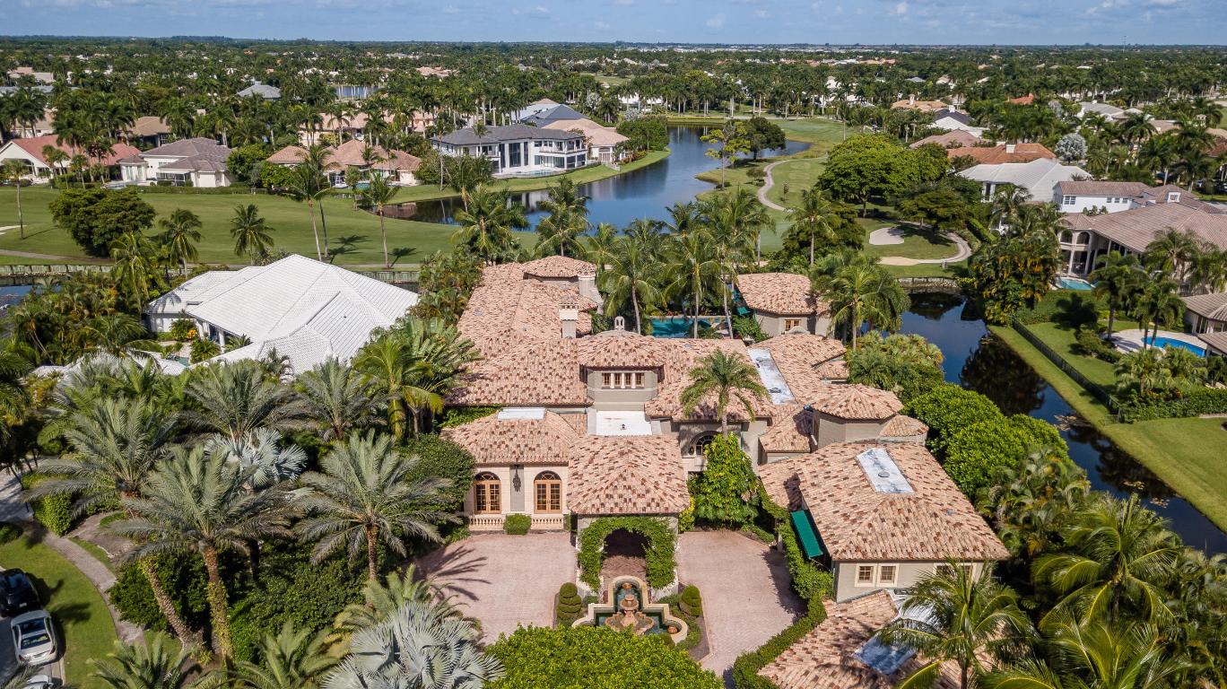 This iconic Palm Beach Estate was designed and built for grand entertainment and ultra privacy.  Set back on almost three quarters of an acre, a tropically landscaped motor-court is accented by a stately  portico of cypress cedar beams that leads to the main entry.  A raised foyer opens to a magnificent great room with views of the oversized pool, patio and gazebo areas.  The main floor features, a master bedroom suite with parlor, dual bathrooms and closet areas, full master suite office, exercise room, a classic club room office, formal dining, media, main kitchen and a back kitchen for live-in-staff.  The second floor features two bedroom suites, a billiard room, office, media room, and an outdoor veranda with bar. A two story guest house features two additional bedroom suites.  More... Description:  A Palm Beach Estate - St Andrews Country Club - Boca Raton Florida 
Impeccably designed estate on quiet cul-de-sac 
Double lot homesite 
Captures sunrise to sunset in privacy and tranquility amid a lush tropical paradise

Foyer: 
Marble floors
3 story Light tower with chandelier 
Marble grand staircase w/ wrought iron and wood rails. 

Great Room:
Marble fireplace 
Custom wood beam ceiling. 
Dual light fixtures 
Great room opens to an entertaining bar area 
Seating overlooking pool patio area. 
Bar has 2 refrigerators & ice makers

Formal Dining room:
Fireplace 
Chandeliers
Extensive custom ceiling mill work. 
Comfortably seats 20 

Media room:
Custom wood built in entertainment center. 
Accordion doors that enclose the area or open it up.


Main Kitchen: 
kitchen area & breakfast dinette area 
Hardwood cabinet. 
Jade marble counter tops 
Subzero refrigerator 
La Cournue  Gas stove 
Center island 
Walk in pantry 
Wall Oven and microwave 
Custom copper hood for cook's area. 
Herringbone pattern Spanish paver flooring
Connecting to dining room 


Staff quarters:
Fully functional prep and catering kitchen
Full laundry room
Staff powder room
Viking stove stop 
Refrigerator 
Granite counter tops. 
Tile floors through out 
Upstairs there are 2 Staff Bedrooms
Common sitting area

Guest House:
2 story guest house 
2 Bed/2 bath, living area and kitchenette
Pecky cypress cedar and ceiling and beams 
Outside shower. 
Separate loggia with cast stone columns
Walkway to lake and golf course 
Rear exposure is west 
Covered lanai 
Cabana bath 
Shower 
Separate laundry room / Washer and dryer 
Tierra cotta tile floors
 bleached and whitewashed pecky cypress wood 
Kitchenette with bar area. cook top and microwave, Sink and refrigerator. 
Media living room area overlooking the pool area. 
Upstairs bleached and whitewashed hardwood floors
2 en-suite guest rooms
Second floor balcony overlooking pool and golf course
Breezeway to outdoor entertainment area

Master suite:
Sitting/Sun room off master open to pool patio veranda
 Extensive custom mill work
Hardwood decorative ceiling beam work with fabric inlays
Fireplace with stone surrounds
Ceiling fan 
Her office directly off Master

Her bathroom:
Vanity make up area 
Walk-in shower 
Circular roman tub 
Accented with cast stone embellishments 
Water closet 
Frame less glass shower doors 
Her closet - fully fitted with abundant mill work, 2 stories, each measuring 30' x 15'

His bathroom:
Frameless Shower doors
Hardwood interiors
Water closet 

His closet:
Hardwood wood floors
Marble counter tops 
Custom wood cabinetry fully fitted with extensive storage

Gentleman's suite:
Billiards game room overlooking pool deck
Built in media armoire
His office with millwork cabinetry and ceilings
Hardwood floor with inlaid carpet
Pendant lights 
Fireplace 
Wet bar  coffee area with ice maker, refrigerator and microwave
Office bathroom. 
Large walk-in storage closet 
Media room seating 6 
Electronics stay and convey in 2nd His media room. 
Black out shades/curtains and dome shaped ceiling with light fixture. 
Media room leads out to fully finished 2nd story loggia
Loggia features covered bar and entertainment area ice maker, sink, refrigerator
Ceiling is pecky cypress with extensive beams. 
Outdoor light fixtures. 
Exterior chandeliers. 
Overlooks the pool, lagoon spa  very private 
Staircase that leads to the pool patio area. 
Connection to 2nd floor of Her closet. 

Main Floor Office: 
Oak floors with Jade marble inserts 
Extensive millwork with custom shelving throughout
Antler chandeliers covey
Powder room bath

Exercise room:
Home gym with connecting bathroom 
Outdoor patio off the exercise room has serene waterfalls
Patio area has cut coral floor.

2 Guest Bedroom Suites (upstairs):
2 full bedroom with en-suite full baths
Hardwood floors 
Carpet in the rooms 
1 suite with balcony. 
Both have walk in closets 

Resort Style Pool, Spa & Patio:
Largest pool in St. Andrew featuring fountains and full length lap pool area
full summer kitchen off the main kitchen. 
DCS gas grill with hood. 
Exterior refrigerators and Ice Makers.
Outdoor Entertainment bar 
Pecky cypress ceiling and beams 
Media center at bar area
Gas Fireplace 
Extensive marble pool patio floor
Entire house opens to pool patio area 
3 entrance areas to the pool. 
70 x 70 Pool 
70-foot lap lane 
Sun shelf 
Retractable sun awning off covered loggia/entertainment area 
Retractable screens to loggia/entertainment area 
Night lighting and outdoor speakers
5 Tropical electronic heat pumps. 
2 filters 
Pool heater  
Gas heater for the spa and waterfall lagoon. 
SW corner of property has a lagoon style pool and spa 

Exterior Entrance:
Dual paver entrance and exit circular driveway with covered portico 
Motor Court with Marble fountain showcases the front entry portico 
Entrance light columns approaching residence. 
Cast stone columns and cast stone privacy wall 
Grand exterior light fixtures 
Stately pecky cypress beam work
Walking path that leads to river rock waterfalls and babbling brook

Exterior/interior features:
Palm Beach style 14,000 sq.ft. estate 
4 car fully air conditioned oversized garage, plus golf cart areas  
Garage feature extensive built-in storage and walk-in pantries  
Copper gutters, leaders and drain spouts 
Full house generator
Impact windows throughout
12 separate air conditioning zones Featuring state-of-the-art Lennox equipment
Full house, exterior access termite prevention system 
Custom hand laid brick chimney 
5 home filter water filtration system for water softening
Iconic window awnings
Thin profile terracotta roof tile 
Crestron "smart home" media, entertainment, lighting and security systems
Elevator