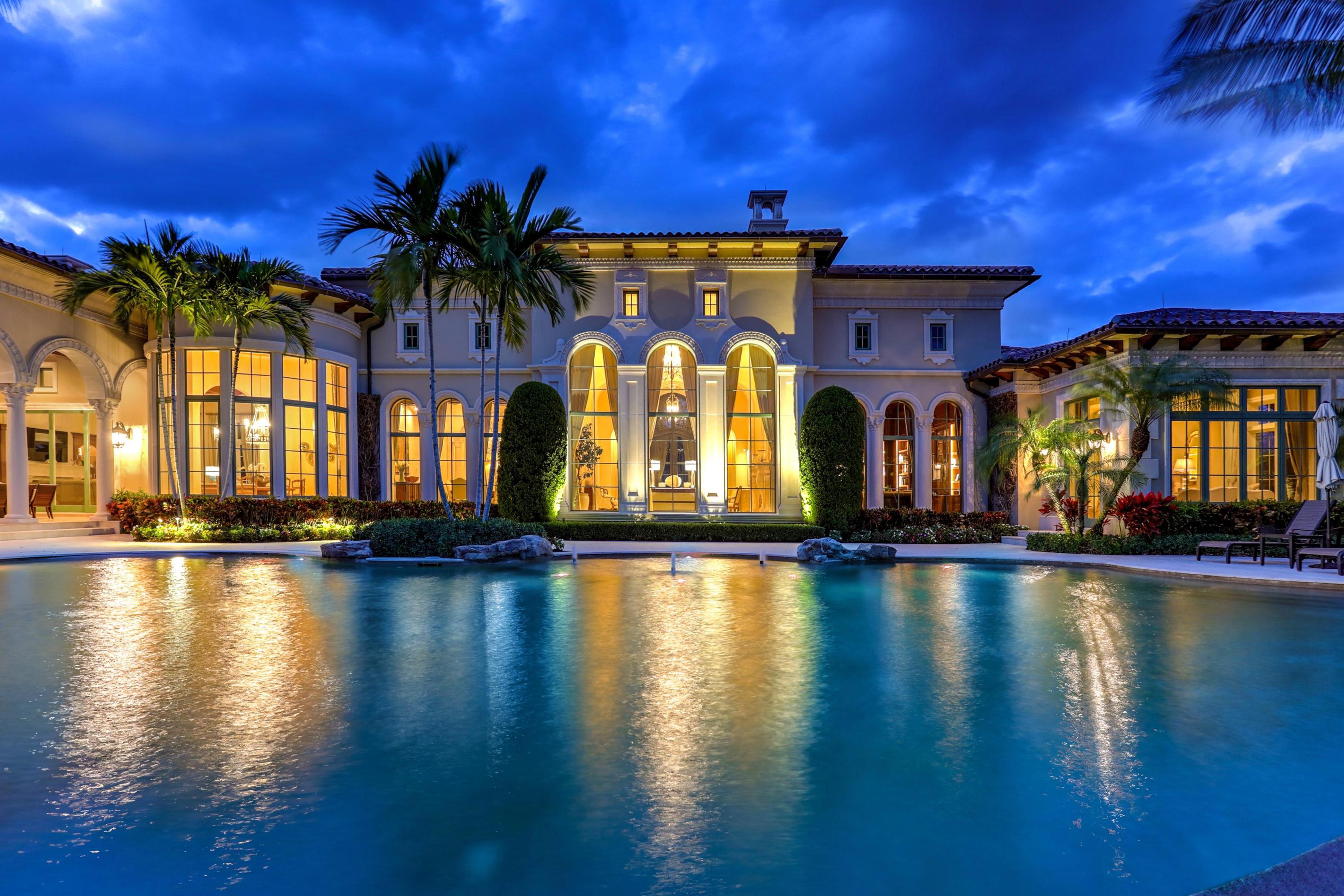 Welcome to your private estate in Old Palm Golf Club. This one of a kind home was designed by acclaimed Affiniti Architects & commissioned by Onshore Construction & Development. This estate home is nestled in a cul-de-sac with an unmatched view of lake and the 17th fairway of the Raymond Floyd Championship Course. It is perfectly appointed with stunning fountains, soaring ceilings, marble & onyx flooring, Jerusalem stone, marble & onyx countertops, high end appliances, gourmet kitchen, club & media room with bar and cabana bath, wine room, butlers pantry, coffee bar, family room, formal living room with double sided fireplace, dining & breakfast room, impressive study, luxurious master suite & 4 guest bedrooms with guest lounge. The outdoor living space features a covered loggia with fireplace, dining & living area, outdoor kitchen & bar that overlooks lagoon infinity pool, lush fenced yard, private putting green and stunning private views.  You will not worry about losing power as this estate comes with a Generac whole home generator.