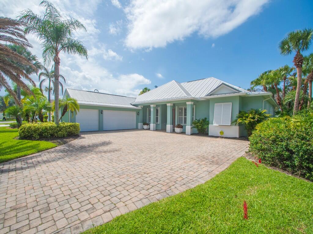 A home that combines timeless elegance and everyday comfort.  This Pool home features 3 bedrooms + Den, 3 baths, 3-car garage, and outstanding curb appeal with an expansive paver driveway, lush tropical landscaping, and a metal roof.  Inside, nice architectural features include high ceilings, elegant tray ceilings and crown molding, as well as plantation shutters & Hunter Douglass Luminette private sheers.   The kitchen offers granite countertops, stainless steel appliances, and a breakfast area with a charming bay window and peaceful views of the tropical landscape and sparkling pool.  The spacious screened lanai and pool are set up to enjoy the great Florida Lifestyle. Whole House Generator. DO NOT MISS!
