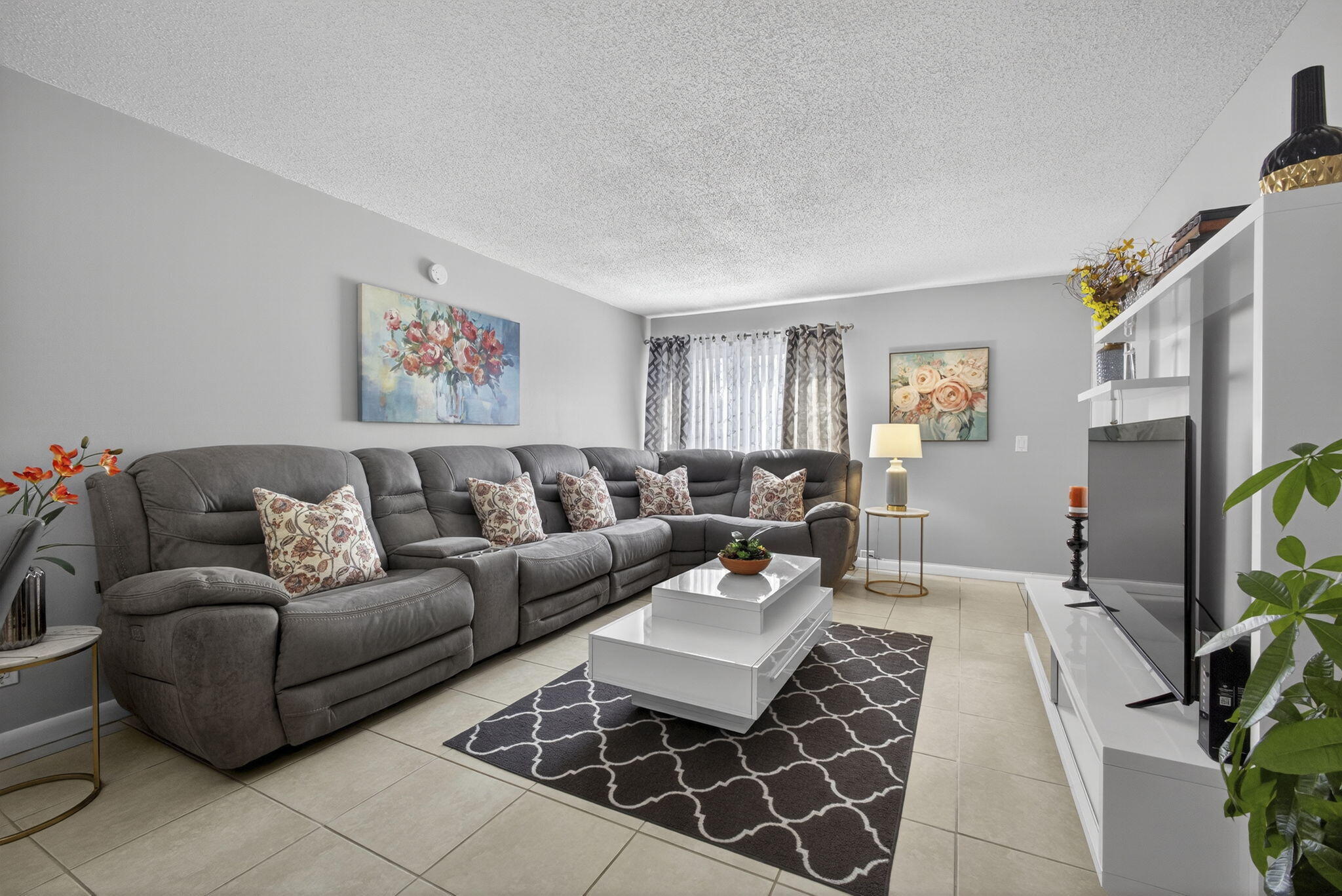 Welcome to this charming first-floor 1BR/1.5BA condo with peaceful water views, an inviting home from the moment you step inside. Upon entering, you'll find tile flooring throughout, abundant natural light, and a comfortable, open layout that flows effortlessly.   This home offers an updated kitchen and bathrooms, a spacious bedroom with a walk-in closet and private ensuite, and a half bath conveniently located off the kitchen. Additional upgrades include a newer A/C, water heater, and electrical panel. Available furnished or unfurnished for a flexible, move-in ready option.  Step out onto your private screened patio and enjoy serene water views and the surrounding nature — the perfect spot for morning coffee or relaxing evenings.  With the canal just steps away, you can spend a leisurely afternoon fishing, making this outdoor space a true retreat.   Located in a quiet, well-maintained 55+ community, residents enjoy multiple pools, a clubhouse, and shuffleboard. The HOA covers cable, water, sewer, building insurance, roof, and exterior maintenance. The roof was replaced in 2022, and the seller paid the assessment in full — meaning one less expense and added peace of mind for the new owner.  Ideally situated in Royal Palm Beach, near parks, shopping, dining, medical facilities, Palm Beach International Airport, and beautiful beaches. This home offers comfort, convenience, and a relaxed Florida lifestyle.