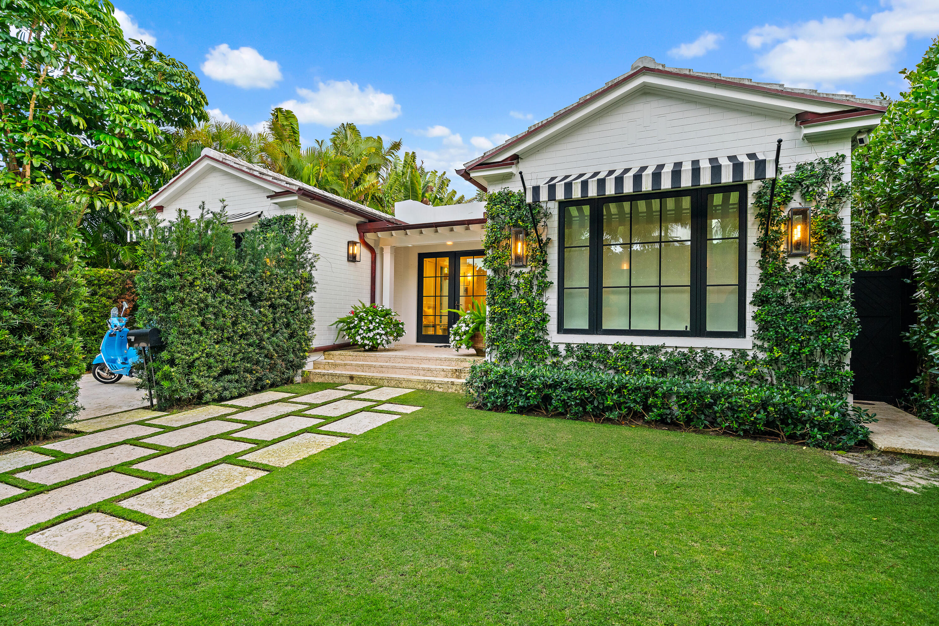 Thoughtfully designed and ideally located, 160 Chilean offers elevated everyday living in the heart of Palm Beach Island. Situated on the ocean block just steps away from the beach, Intracoastal, and Worth Avenue. Renovated in 2024, this single-story 4BR, 3.5BA residence features a primary suite, two large guest suites, and a custom bunk room with full-sized beds. The kitchen features premium Miele appliances and a luxury Lynx outdoor kitchen and dining area. Dual retractable Markilux awnings creates seamless indoor-outdoor living. Skylights bring natural light to the living room which opens up to a cozy den featuring a lovely birch log gas fireplace. The nearly 8,000 sqft lot includes a Dominican Coral patio, manicured lawn, and PebbleTec pool with spa and sun shelf.