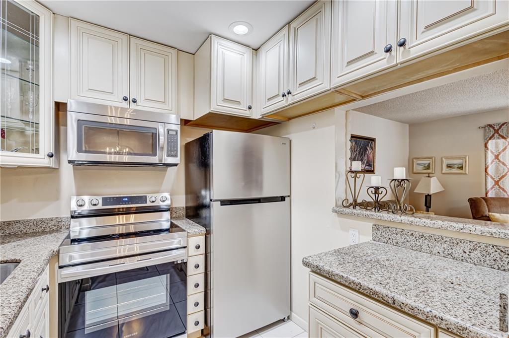 Back on the market due to a chance in by-laws! This 1st floor fully furnished 1 bed, 1.5 baths condo has been fully remodeled and offers a bright open floor plan with a screened in Patio. Upgrades include high-impact windows, tiled flooring, ceiling fans, remodeled kitchen with granite counters new stainless steel appliances and antique white cabinets. *Note: Waltham G changed rental policy no rentals for 2 years. The community has 24 hour security & the Club House offers: fitness center, in/outdoor pools, sauna, billiard room, library, card and activity rooms, beauty parlor/barber shop and even a theatre for movies and shows! Located near the beach, the airport & shops this is resort style living at it’s finest!