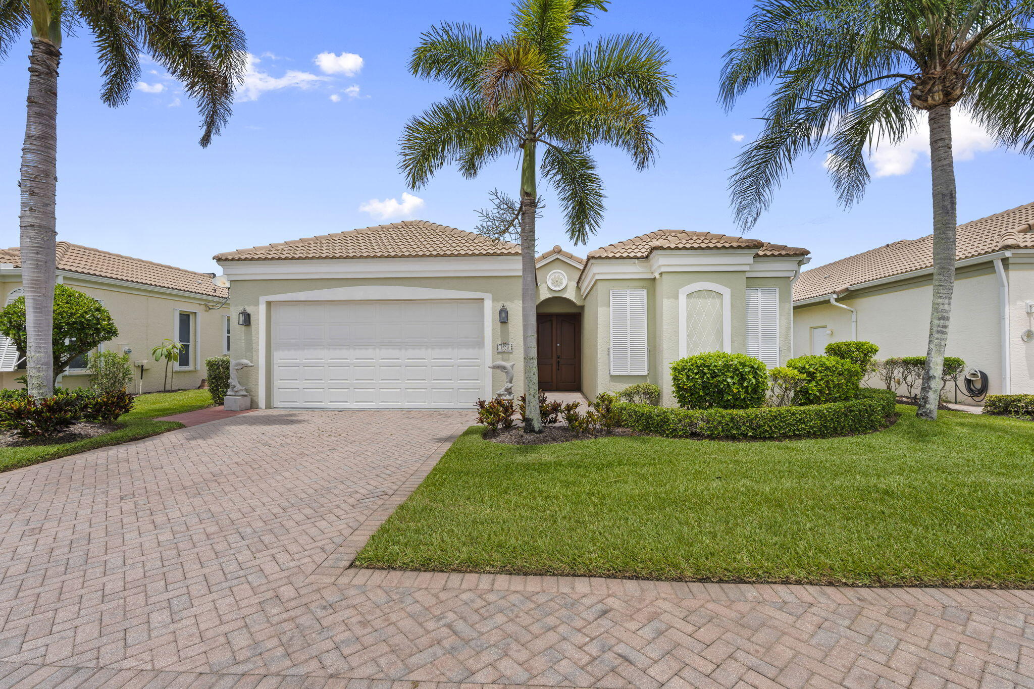 Experience the best of coastal living in this beautifully maintained 3-bedroom, 3-bath courtyard home nestled between the river and the ocean. Step into the screened courtyard and you'll see why it's the heart of the home. Perfect for morning coffee, evening cocktails, or just or simply enjoying the Florida breeze, complete with an outdoor shower for easy post-beach living. Guests enjoy their own private retreat with a casita suite featuring a full bath and ample space for a king bed. Inside, the home showcases 10-foot ceilings, a bright white kitchen, crown molding, plantation shutters on every window, and accordion shutters throughout for added peace of mind. The primary suite offers a quiet escape with tray ceilings, a sitting area, lake views, and direct courtyard access.  From the screened lanai, take in wide water views and unforgettable sunsets. Located in the gated Riverpointe community within The Sands, residents enjoy private beach access, an infinity pool, clay tennis courts, and a marina with boat slips available for purchase or lease. Close to Pepper Park, the Navy SEAL Museum and the Jetty!