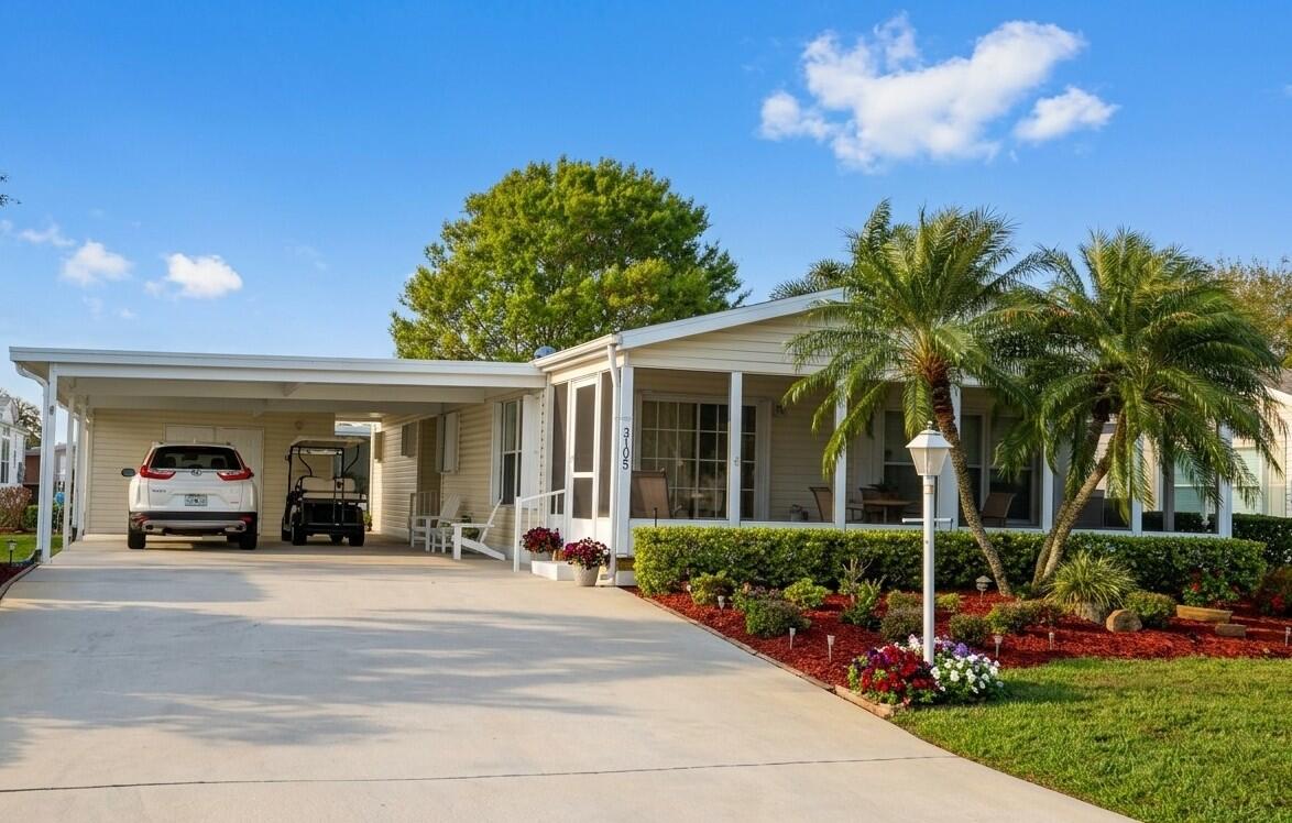 Gorgeous, move in Ready! $20,000 price reduction! Located in fabulous 55+ Savanna Club. This 2-bedroom, 2 bath home has been meticulously maintained. Offered partially furnished. Large carport. roof replaced in 2020, A/C in 2019. 18-hole golf course located in Savanna Club, 3 club houses (one is totally fitness), tennis courts, Pickel ball, bocce, 3 heated pools, Accordion hurricane shutters, sprinkler on a well.  HTW replaced in 2025. Active social community. Fitness center in each clubhouse. Restaurant also in Savanna Club. Large master suite. Double sinks in master bath. Fully equipped kitchen. Breakfast nook adjacent to kitchen. Full size washer and dryer, indoors. 700 seat theatre. Savanna Club has its own RV storage lot for residents only. Land lease property.