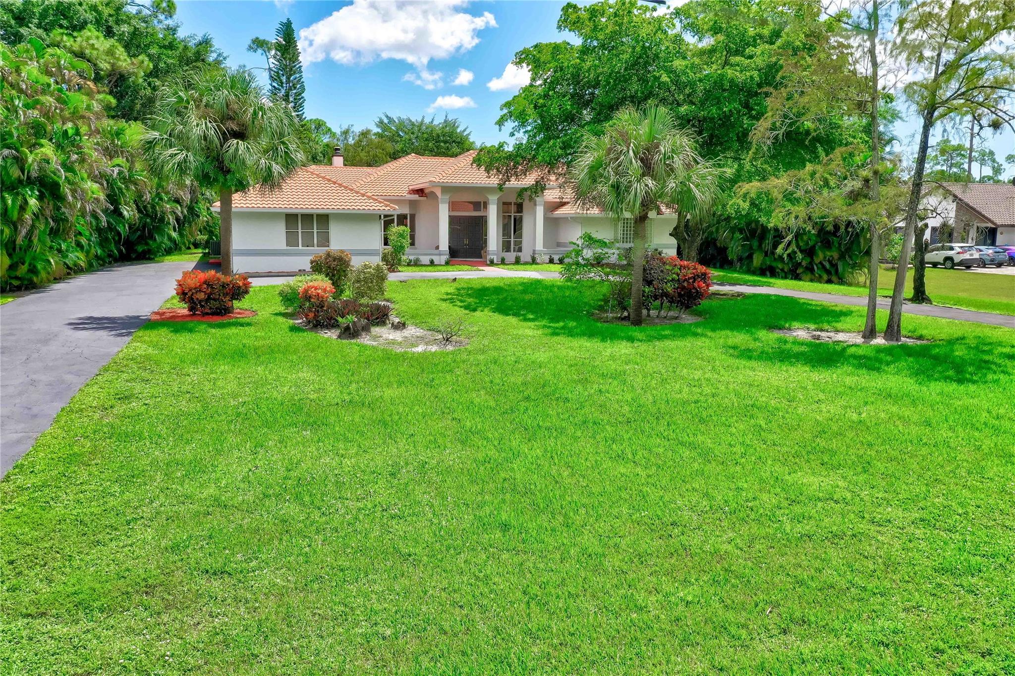 MUST SEE 4/3 POOL HOME W/A 3 CAR GARAGE LOCATED ON MORE THAN AN ACRE! THIS FRESHLY PAINTED & UPDATED HOME HAS ALL THE BELLS & WHISTLES AS FOLLOWS: 2017 BARREL TILED ROOF!UPDATED MAPLE KITCHEN W/ BEAUTIFUL GRANITE COUNTER TOPS & BACKSPLASH!G.E. PROFILE STAINLESS STEEL APPLIANCES/DOUBLE OVEN/INDUCTION VENTED RANGE!WIDE PLANK WOOD FLOORING IN THE BEDROOMS W/ THE MAIN BEDROOM HAVING A DARK MAHOGANY LOOK!UPDATED BATHROOMS W/THE MAIN FEATURING ALL HIGH END RICH WOOD CABINETS & GRANITE W/SLATE LIKE INLAID TILES IN THE STEP IN SHOWER!ADDED CABINETRY & GRANITE IN THE ENCLOSED WATER CLOSET AREA!BUBBLE BATH TUB!JOHN LOUIS CLOSET ORGANIZERS W/EXTRA STORAGE FOR LUGGAGE LAUNDRY ROOM HAS ALL NEW CABINETRY!YOU'LL LOVE THIS ENLARGED HURRICANE SCREENED IN POOL WITH AN OVERSIZED 2200 SQ. FT POOL & PATIO.