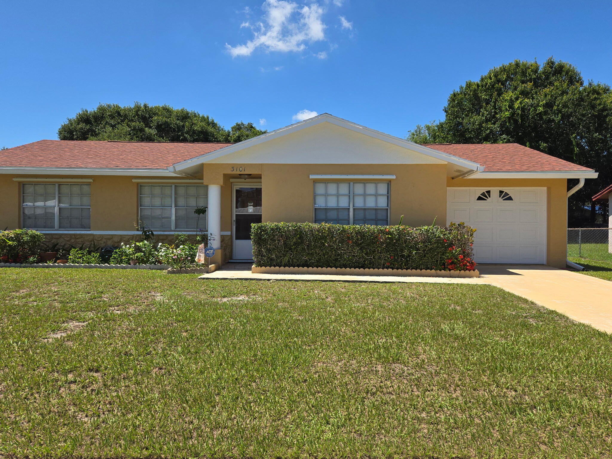 Welcome to this charming single-story residence in Pinecrest Estates in Fort Pierce, offering 3 bedrooms, 2 bathrooms and a comfortable living space. Situated on a generous 0.21 acre lot, this home features an efficient one-story layout that makes everyday living convenient, while the attached one-car garage provides protected parking and storage. This well-designed floor plan offers practical functionality for those seeking comfortable, no HOA fees in an established community. Updates include a roof that is 3 years old and an A/C system that is 5 years old, providing added peace of mind. The home is equipped with storm shutters for added hurricane protection and has been recently painted on the exterior and boasts a huge backyard with mature fruit trees. Seller is highly motivated!  Please verify all measurements and tax information.