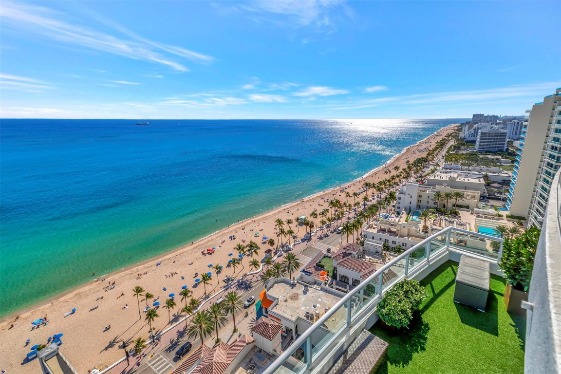 OVER 7800 TOTAL SF!!!!! Incredible opportunity to own the entire South end of the 22nd floor of the Ritz-Carlton Private Residences. This one of a kind private residence recently completed a 2 year, $2M renovation with premium finishes throughout. Revel in the most exquisite 280 degree views from the SE corner Atlantic Ocean wrapping to Intracoastal views & sunsets over the downtown skyline. Living space is doubled with nearly 4000 SF of open air terrace space, complete with a full outdoor kitchen, an outdoor living room, water features & full audio-visual entertainment. The entry greets one with an art gallery suited for the finest collection. Two guest suites & a den line the gallery hall. State of the art AV & lighting technology immerses all of the senses into aesthetic intelligence. Experience the ultimate Ft. Lauderdale Beach lifestyle with private penthouse living, perfectly blended with awardwinning Ritz-Carlton amenities, hospitality & pampering