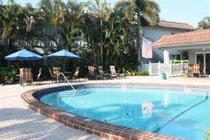 Open Sat and Sun 2-4 pm. Owners will consider owner financing with 25% down.  East of I-95. 3 miles to Ocean, Never been lived in. All new electric, plumbing. White  cabinets, quartz countertop and back splash. Led lighting. Lg. pantry. There is even a pot filler. All new stainless appliances. Huge rooms. Luxury woodgrain vinyl flooring in herringbone pattern. Impact windows, High end bath w/ rain forest shower & glass panel. No popcorn ceilings. Financially sound complex. No Popcorn ceilings. Wi-fi compatible  devices. Well maintained property. Friendly, safe atmosphere. Tropical courtyard with heated pool. Loads of recliners and tables. Clubhouse with wi-fi, TV and kitchen. 1 pet per unit up to 20 lbs. allowed. Coinless laundry just steps away. Additional storage. secret in Ft. Laud.