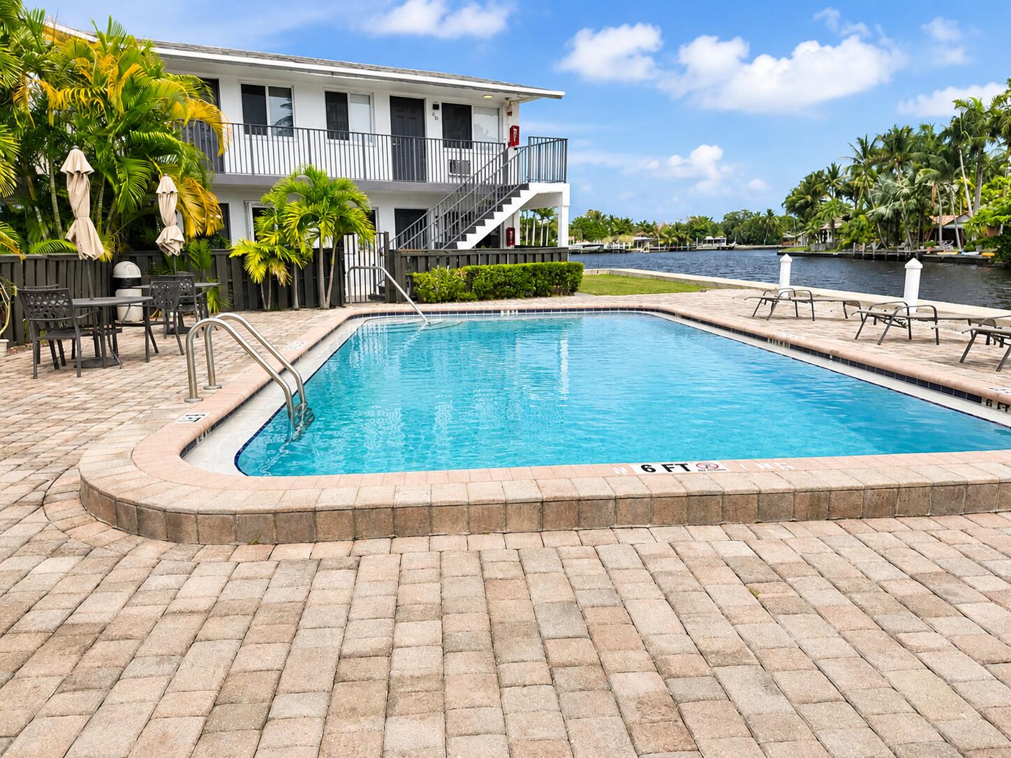 Enjoy the best of South FL living at Three Rivers East in Oakland Park, a boutique condominium This first-floor residence features easy access, tile flooring throughout, and a comfortable layout designed for everyday living. Nestled along the scenic Middle River, the community offers beautiful waterfront views, a community swimming pool with water views, community laundry facilities, guest parking, and a relaxed waterfront atmosphere. The unit includes an assigned parking space for one vehicle, ample guest parking for visitors. Ideally located just west of US-1 and only 2 miles from Fort Lauderdale's beautiful beaches, residents enjoy convenient access to Wilton Manors, Coral Ridge, shopping, dining, entertainment, parks, and major roadways. Exceptional value ina highly desirable location.