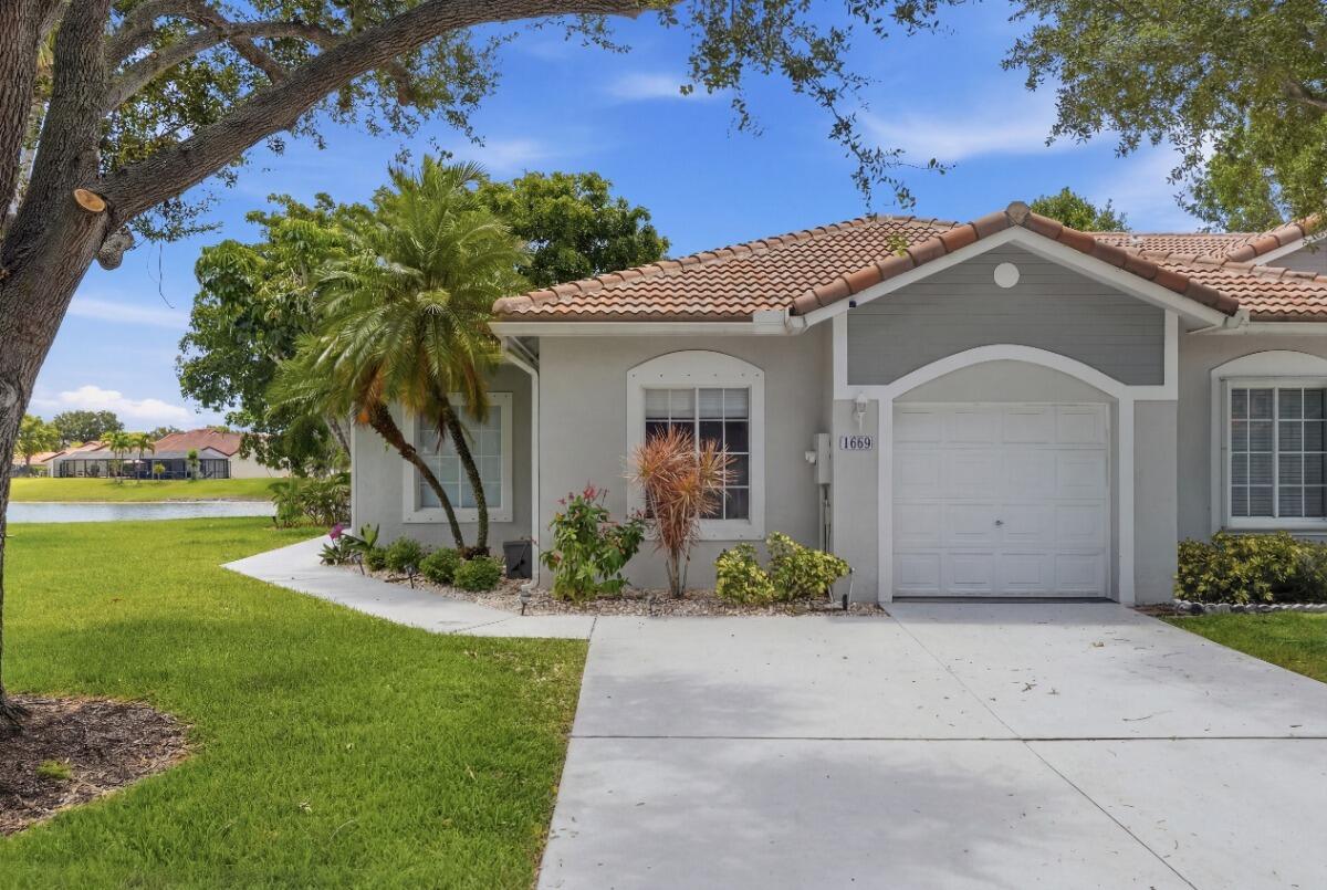 Beautifully updated 3-bedroom, 2-bath corner villa with 1,495 sq. ft. in Harbor Bay at Waterways. Enjoy a premium corner lot with stunning lake views, abundant natural light, smart home features, new flooring, updated lighting, 9-foot ceilings, and an open layout. The kitchen offers white cabinetry, under-cabinet lighting, and stainless steel appliances. The primary suite features a custom walk-in closet, an additional reach-in closet, and an updated bath. Relax on the screened porch or lakeside patio with roll-down privacy screens. Features a 1-car garage with overhead storage racks, a 2-car driveway, Main roof (2020), flat roof (2021). Guard-gated community with two clubhouses, cable, internet, and amenities.