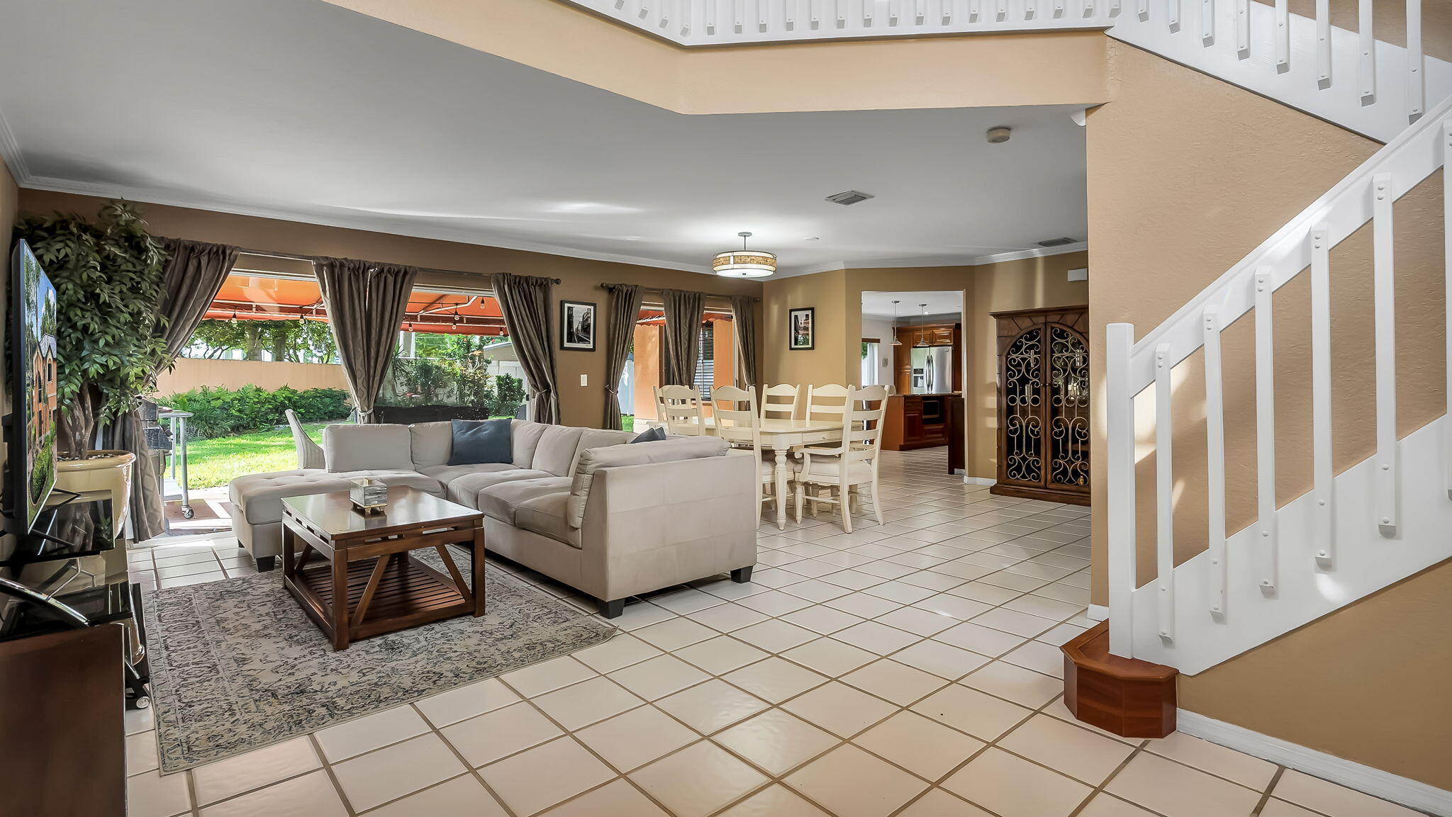 Welcome to Reflections at Rock Creek, a gated Cooper City community known for top-rated schools and resort-style amenities. This beautifully maintained home offers 3 bedrooms plus an oversized loft/flex space ideal as a potential 4th bedroom, office, media room, or guest retreat, along with 2.5 updated baths. Soaring ceilings and natural light complement the open floor plan featuring a custom kitchen with wood cabinetry, granite countertops, stainless steel appliances, designer backsplash, and large island. Recent upgrades include a 2025 standing-seam metal roof, newer A/C, newer water heater, CCTV security system, and dry bar. Enjoy a covered patio, fully fenced yard, and room for a future pool. Amenities include pools, clubhouse, fitness center, lakes, playgrounds, and walking trails.