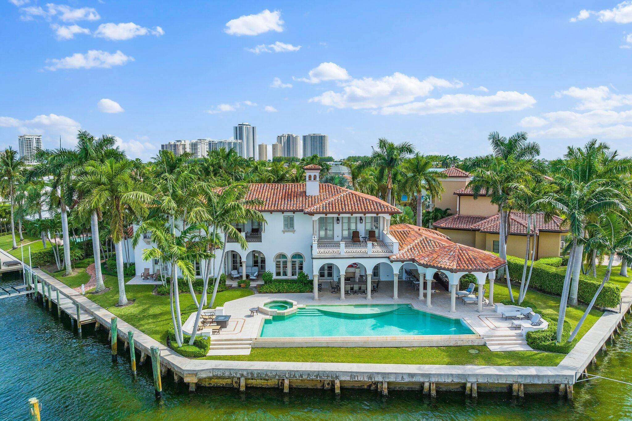 Built in 2008, this rare waterfront home boasts 230 feet of water frontage with spectacular panoramic views. The current waterfront layout can accommodate a 100 ft. boat. Sold fully furnished, the 9, 850SF home has a beautiful outdoor space: 5beds w/private en-suite baths. oversized loggias & terraces, summer kitchen & 50-ft infinity pool overlooking the water. See Supplement:

Built in 2008, this rare waterfront home boasts 230 feet of water frontage with spectacular panoramic views. The current waterfront layout can accommodate a 100 ft. boat. Engineered plans with seagrass survey are in hand to build a second dock on the ICW side with a boat lift. The 9, 850SF home has a beautiful outdoor space: 5beds w/private en-suite baths. oversized loggias & terraces, summer kitchen & 50-ft infinity pool overlooking the water. Inside: Elevator leads to the master suite: private balcony, water views & private laundry. Living area: open kitchen w/2 center islands, Wolfe stove, double ovens, granite counters, high-end appliances, custom lighting, grand dining room & living room. Built in '08 the home has a private study & multi-purpose area. Features include custom moldings and hurricane impact windows throughout as well as hand-carved coral stone fireplaces, and Pecky Cypress beams. Near restaurants, shopping & ocean. Rarely does a property come on the market that can accommodate multiple vessels of multiple sizes.
