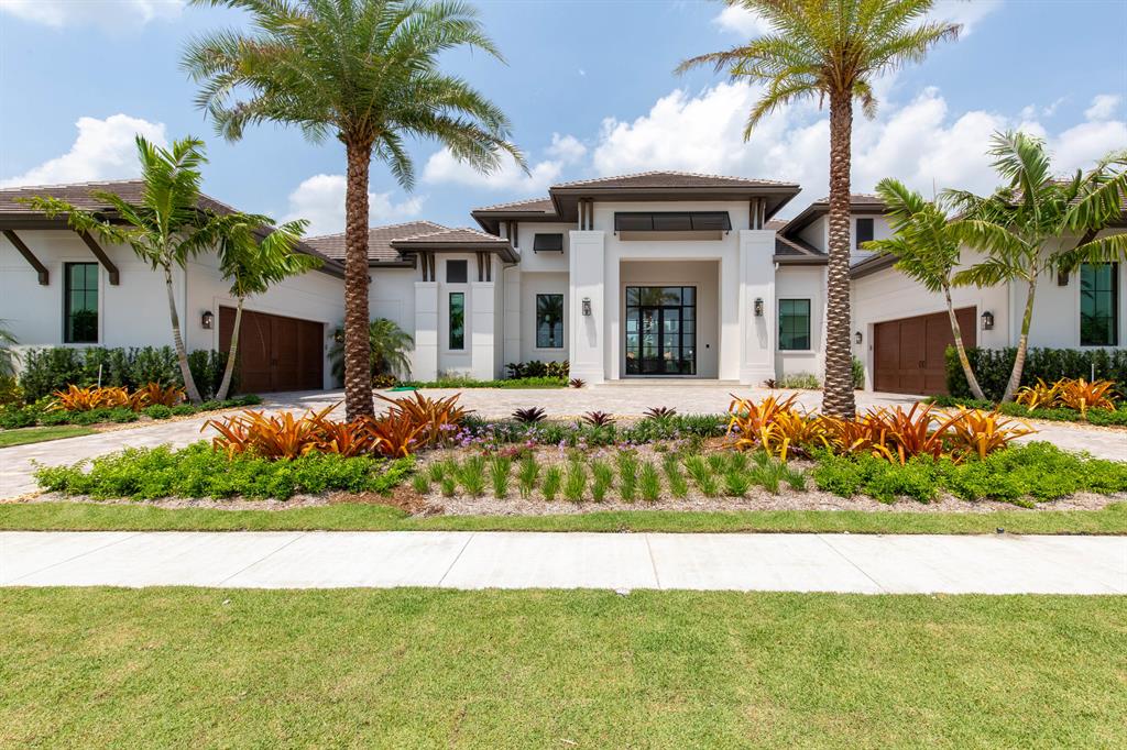 An outstanding creation..This new construction home is brought to life by the innovative masterminds at Soco Interiors and Stock Custom Homes and is ideally located in the private community of Palm Beach Polo on a water-front half acre lot. This custom build features 4 bedrooms, 4 full baths, 2 half baths, split 4 car garage, and just under 7,000 square feet of living space. Reaching its fullest potential as an entertainer's dream- this property boasts an oversized patio with private space for both owners and guests with a luxurious pool, outdoor kitchen, dining area, and multiple fireplaces. Inside you'll find exquisite finishes throughout the bedrooms, each featuring private baths and walk-in closets.