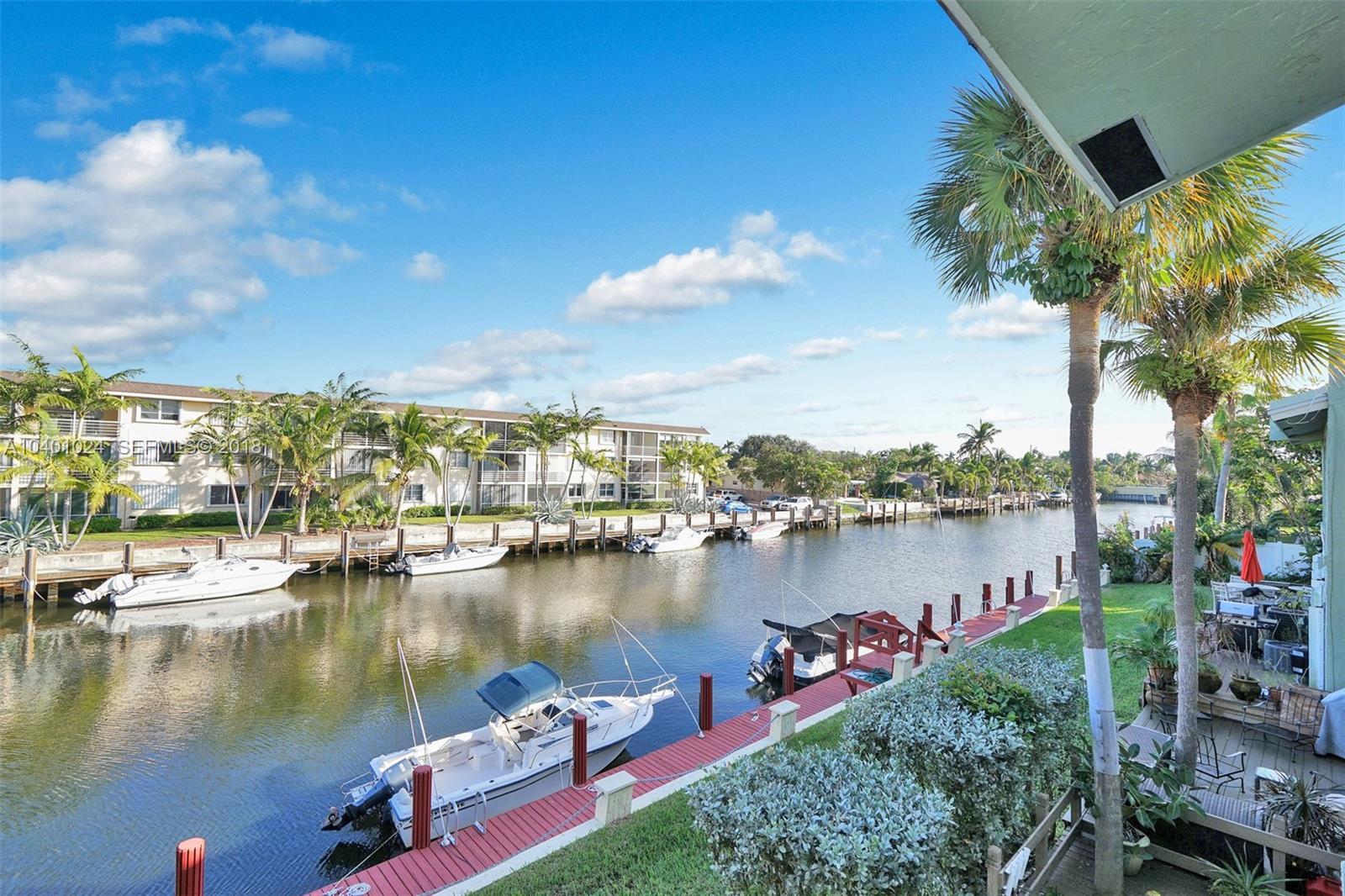 Welcome to 2113 NE 44th Street #7, a beautifully updated townhome in the heart of highly desirable Lighthouse Point. Intercoastal with dock-BRING YOUR BOAT!! This spacious 2-bedroom, 2.5-bath residence offers nearly 1,750 square feet of comfortable living space with a stylish, modern feel throughout.  The main level features an open and inviting layout, perfect for everyday living and entertaining. The kitchen flows seamlessly into the living and dining areas, creating a bright and functional space with plenty of room to relax or host guests. Upstairs, both bedrooms offer privacy and comfort, including a generous primary suite with great closet space and an en-suite bath.   Located in one of Broward County's most sought-after coastal communities, this home places you close to shopping, dining, marinas, parks, beaches, and everything Lighthouse Point has to offer. Whether you're looking for a full-time residence, seasonal getaway, or low-maintenance South Florida lifestyle, this property delivers the perfect combination of space, location, and convenience.