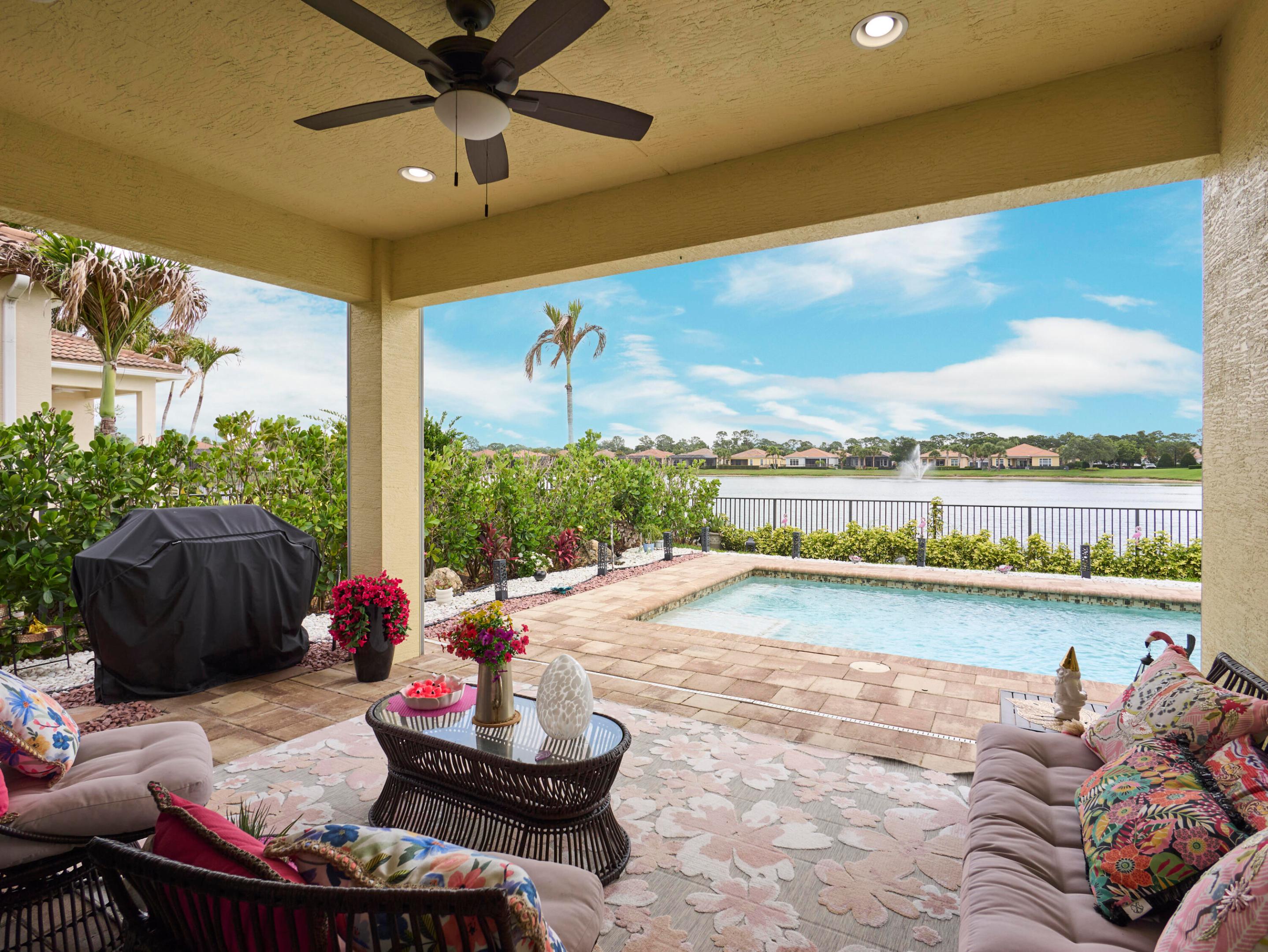 Upscale and designer-finished, this award-winning former model home in PGA Verano blends modern elegance with relaxed Florida living.  Enjoy an open-concept layout, refined finishes, abundant natural light, and seamless indoor-outdoor flow. The private lanai offers a sparkling pool, expansive lake and clubhouse views, and automatic hurricane-rated screens for added comfort, privacy, and year-round enjoyment. Just a short walk to Talavera Clubhouse and PGA Verano's impressive resort-style amenities, this home offers the rare combination of privacy, location, and lifestyle in one of the community's most desirable settings.