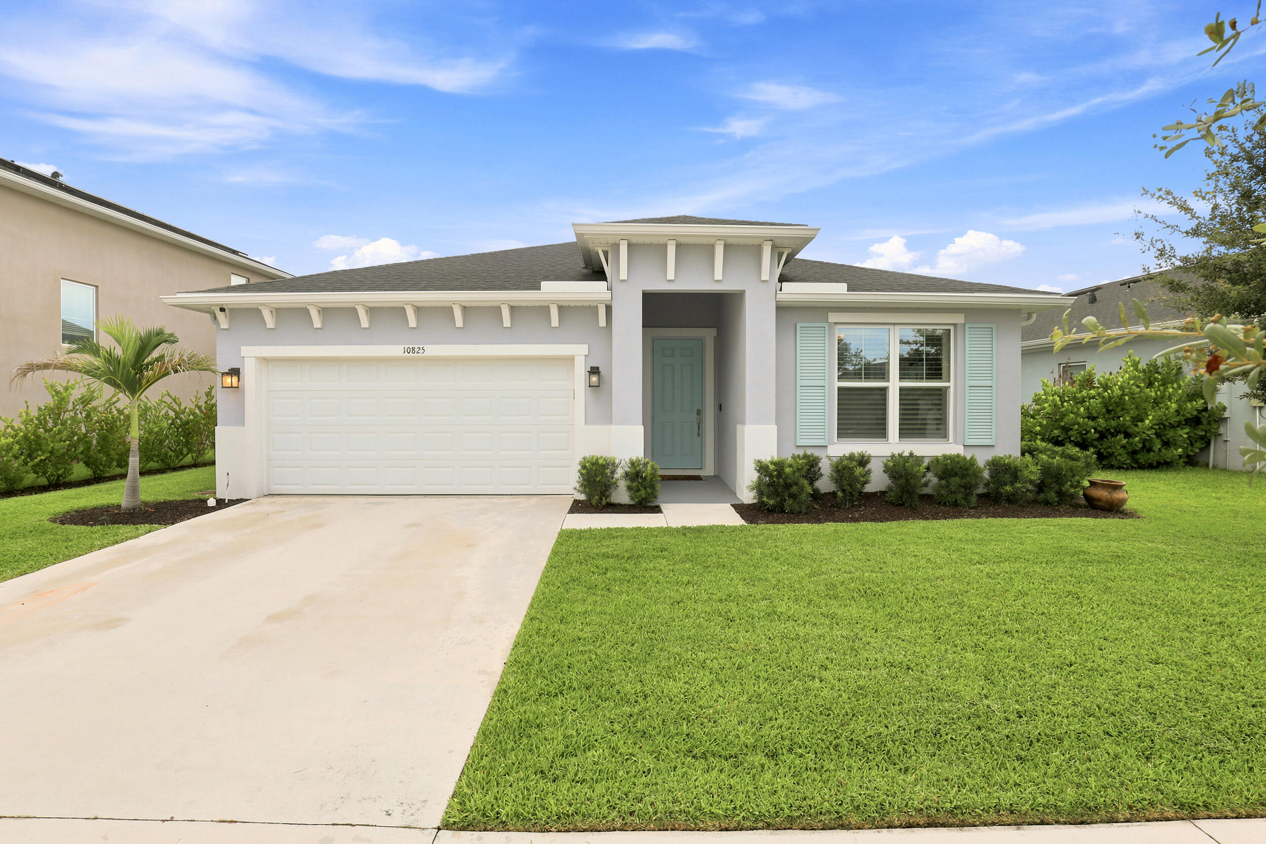 Move-in ready lakefront beauty! Offering 4 bedrooms and 3 full baths, this impeccably maintained home combines style, comfort, and functionality. The open-concept floor plan is complemented by LVP flooring throughout the main living areas, volume ceilings, granite counter tops throughout, beautifully tiled showers, and a spa-inspired primary bath with a frameless glass shower. Step outside to your fenced backyard and unwind under the extended covered lanai while enjoying peaceful pond views. Hurricane IMPACT WINDOWS throughout, gutters, and quality finishes add to the home's appeal. Residents enjoy low HOA fees including Blue Stream Fiber and access to a community pool and playground, all just minutes from Tradition, excellent dining and shopping, and convenient access to I-95.