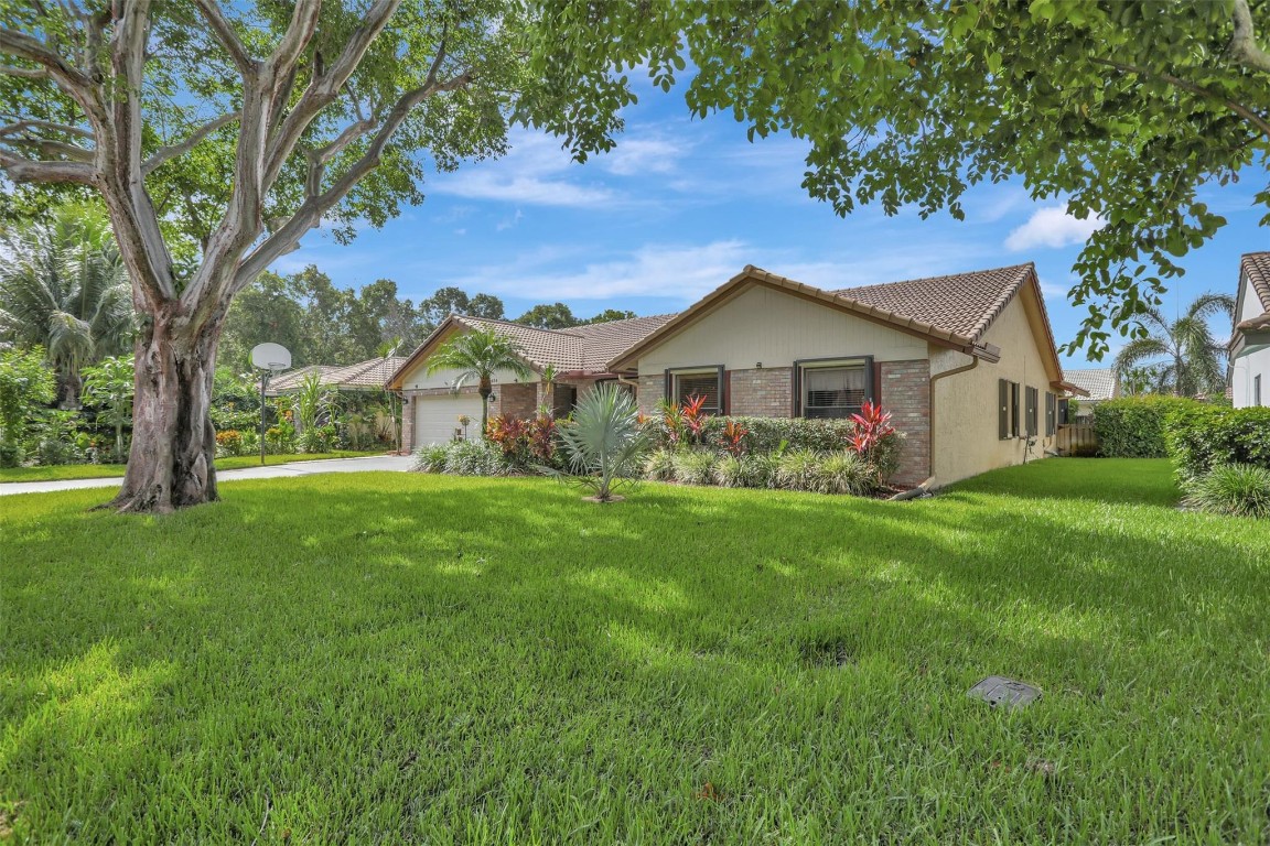 Truly a dream oasis! (See 3D virtual tour.) This stunning cul-de-sac home offers tranquility & convenience while combining style w/ functionality. Views of the resort-like pool area from the kitchen, family rm, living rm. Spacious kitchen features upgraded wood cabinets, granite, SS appliances, island + brkfast area. *All windows have accordion shutters; garage door is Miami-Dade approved. Updated bathrooms have impact cabana doors to the tropical pool area.* All bdrms are generously sized. Living areas have vaulted ceilings. Relaxation is yours as the pool bar and TVs stay! Gorgeous paver pool deck-2021. *Updated elect panel. Plantation shutters. Beautifully maintained home is close to shopping & highways for easy commuting. Schools and Fern Glen Pk are a short walk. A winning decision!