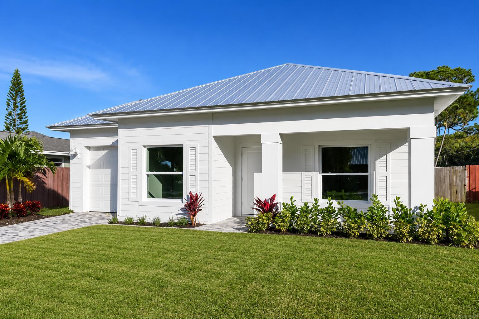 Brand-new construction coming soon to Palm City with anticipated completion Late 2026. This thoughtfully designed 3-bedroom, 2-bath home offers modern style, quality craftsmanship, and an open-concept floor plan ideal for everyday living and entertaining. The spacious layout features a large family room, split-bedroom design, and a private primary suite with walk-in closet and beautifully designed bath. The kitchen opens seamlessly to the main living areas and includes a functional island layout with ample cabinetry and workspace. Additional highlights include impact windows and doors, indoor laundry room, covered entry, attached garage, and soaring ceilings that create a bright and airy feel throughout. Conveniently located close to shopping, dining and top-rated schools