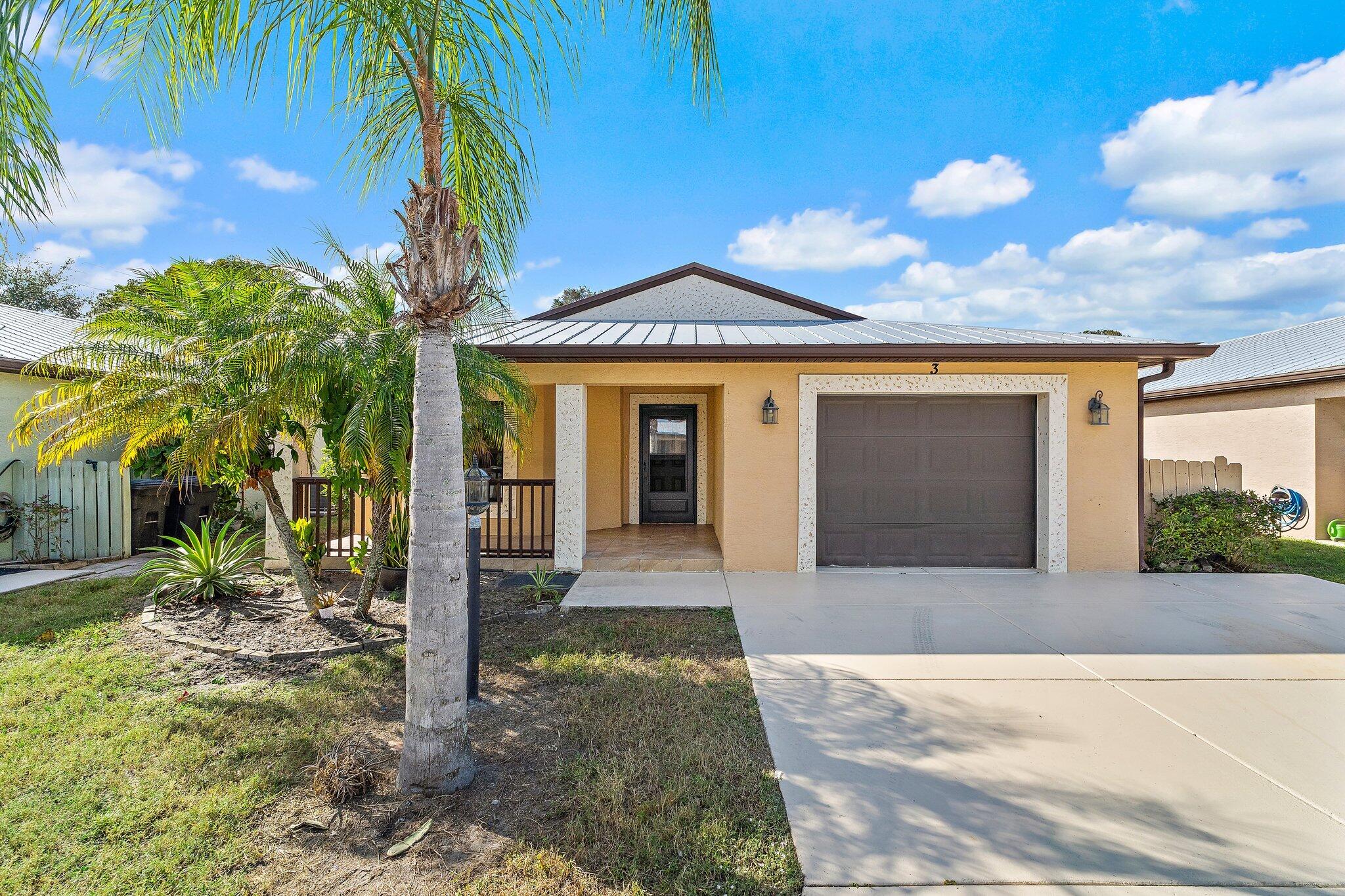 *PRICE IMPROVEMENT MOTIVATED SELLER* Welcome to 3 S Granada Lane, a stunning 2018-built home nestled in the sought-after Spanish Lakes One community. This concrete block residence boasts durability and style, topped with a metal roof that offers peace of mind and energy efficiency.  Step inside to find beautiful tile flooring flowing throughout the home, with the exception of carpet in the master closet. The heart of the home, the kitchen, features granite countertops and stainless steel appliances. Enjoy the convenience of a dedicated laundry room with ample storage cabinets! The spacious master bedroom is complemented by an ample-sized master bathroom, featuring dual sinks and a stylish walk-in shower, providing a serene retreat after a long day.   One of the highlights of this home is the picturesque lake view from the backyard, creating a peaceful oasis for relaxation or entertaining friends. Lots of wildlife to be seen while you take in the tranquility.   Please note that this home does not own the land; it comes with a land lease of $818 per month.   Spanish Lakes One offers an active lifestyle with a wealth of amenities, including a clubhouse, pool, fitness center, and various recreational activities to engage in. This 55+ community is perfect for those looking to enjoy a social and enriching environment.  Don't miss your chance to own this beautiful home in Spanish Lakes One! Schedule your private showing today!