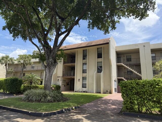 This immaculate 2/2 condo is located in desirable Concord Village in the heart of Tamarac, this premier 55+ community is  well maintained  offering a serene and active lifestyle with access to a clubhouse and various activities. Just steps away from the pool, this property boasts tranquil public golf course views. This is the largest unit available. Interior features offer a sun-filled living room and dining area, kitchen with plenty of cabinet space, Large primary suite with walk-in closet and additional closet, dressing area, glass enclosed step in shower. Second bedroom with large closet is located just outside a full guest bathroom. Lots of closets plus washer/dryer hookup. An enclosed screened porch is easily accessed from the living room and primary suite. Additional secured storage space and laundry room are just steps away from the unit for added convenience. Unit is located on the second floor with elevator access. Concord Village is conveniently located just minutes away from shopping, dining and medical facilities, ensuring all your needs are within easy reach. Don't miss the opportunity to live in or invest in this vibrant and well-kept community. Perfect for those seeking a blend of tranquility and an active lifestyle in South Florida! Seller will pay roof assessment in full at​​‌​​​​‌​‌​​​‌‌​​​‌‌‌​​‌​​‌‌​​​​ closing.