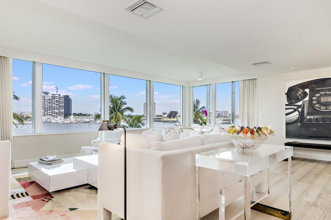 :SPECTACULAR VIEWS from this direct lakefront 3 bedroom apartment. Balcony enclosed making it an additional 250 sq ft. Completely redone with hurricane windows and impeccably designed. Rare to find a 3 bedroom, 2 bath, pristine condition. Located on the third floor at the end of building, quiet. Amenities include, basic Cable, Wi-Fi, water, electric. beautiful pool, jacuzzi, putting green, deli, dentist, hair salon, workout room, 44 Restaurant with room service, valet parking, hurricane shutters, main generator and more! Hottest building on the island, make this your forever place!