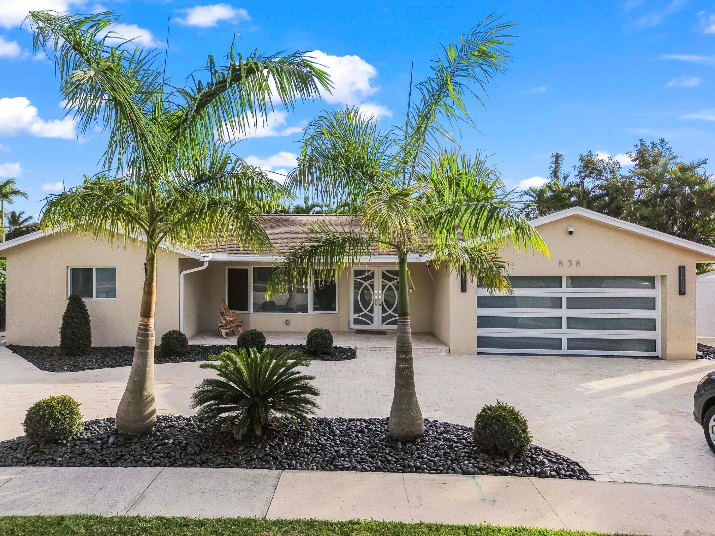Step into this stunningly reimagined home, where modern elegance meets luxurious comfort. Every inch of this property has been meticulously updated with premium finishes and thoughtful design. The expansive living room features floor-to-ceiling sliding glass doors that seamlessly blend indoor and outdoor living, offering breathtaking views of your very own resort-style pool and jacuzzi oasis, framed by swaying palm trees.

The home's split, open floor plan offers 2 generously sized bedrooms and 2 full bathrooms, ensuring both privacy and spaciousness. Gleaming neutral marble flooring flows throughout, setting the tone for sophistication. The sleek, modern kitchen is a chef's dream, complete with high-end Miele appliances and stylish finishes. Safety and peace of mind come standard with hurricane impact glass doors and windows, while the fully fenced yard, heated pool, and jacuzzi provide a serene private escape. The professionally landscaped grounds elevate the ambiance, and recent updatesincluding a new roof, new A/C system, tankless water heater, and pool heaterensure worry-free living.

Nestled in one of East Boca Raton's most sought-after neighborhoods, this home offers unparalleled convenience. You're minutes away from top-rated schools, including the prestigious Addison Mizner, as well as downtown Boca, major highways, and the beautiful sandy beaches. With no HOA fees and a move-in ready condition, this property is perfect as a year-round home, vacation getaway, or savvy investment. Don't miss this rare opportunity to own your slice of paradise!