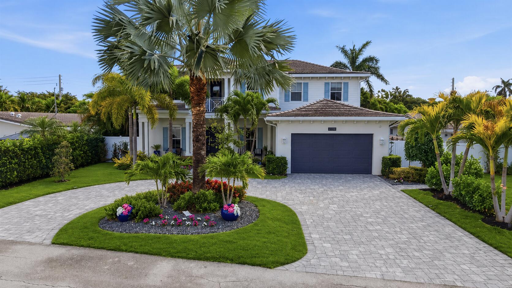 Built in 2018 by Collin Builders, this Key West-style home offers 5 bedrooms and 4 full baths with over 3,500 sq ft under air. First floor features 10-ft ceilings, open living area, bedroom with full bath, office, and flex space for a dining room, another office or playroom. Chef's kitchen with custom cabinetry, two islands, KitchenAid appliances, two dishwashers, wine refrigerator, pantry, breakfast area, and reverse osmosis system. Upstairs includes 4 bedrooms, 3 baths, loft, balcony, and 9-ft ceilings. Primary suite with walk-in closets, soaking tub, and rain shower. Tropical backyard with heated saltwater pool, cold plunge, sauna, and outdoor shower. Impact windows & doors, flat tile roof, oversized 2-car garage. Near Dan Witt Park, Frank McDonough Park, and Lighthouse Point Yacht Club