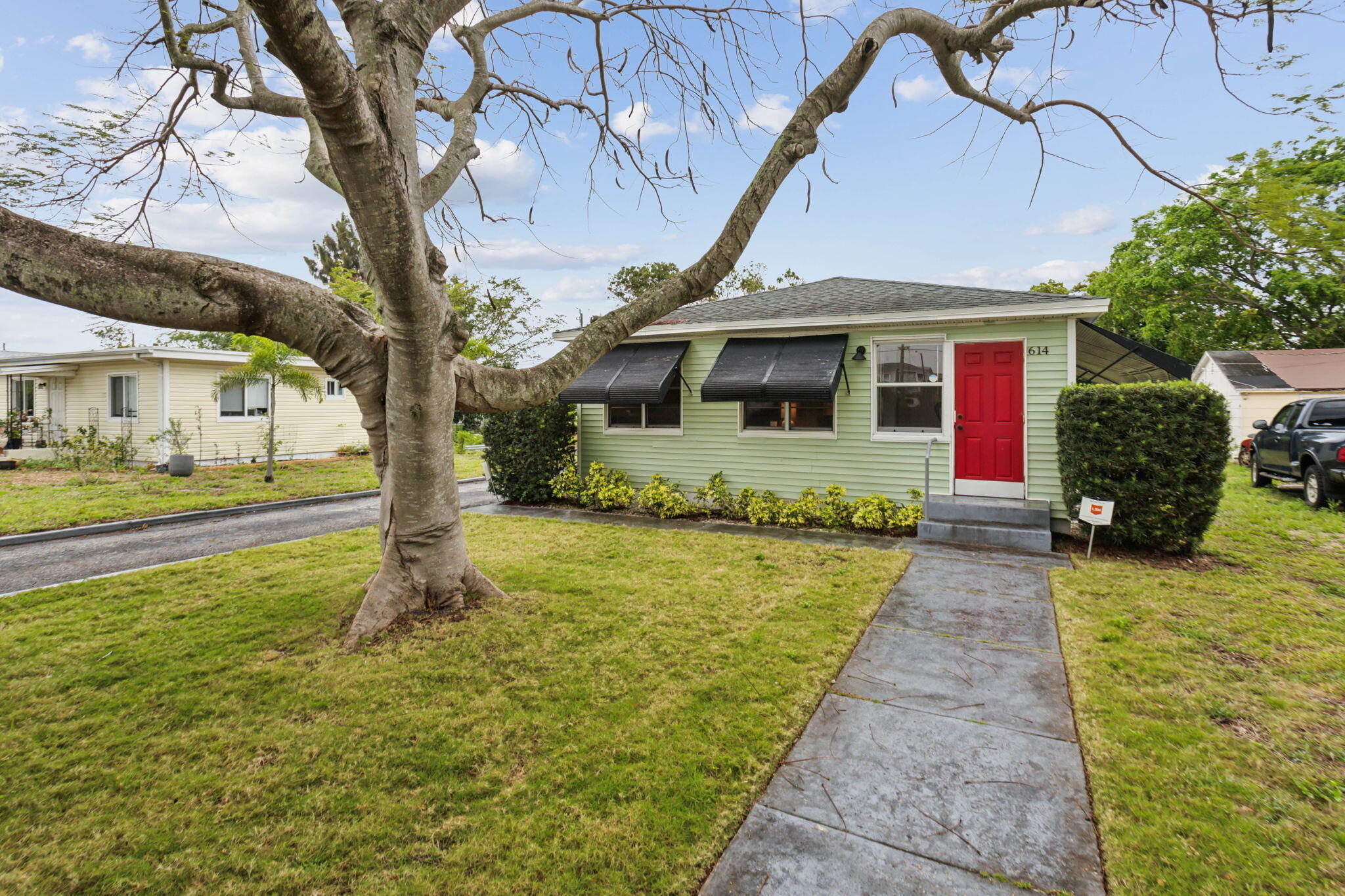 Discover this charming 2-bedroom, 1-bath home plus beautiful Sunroom, in the heart of Lantana! Recently renovated, this inviting property features a beautifully updated kitchen, fresh interior paint, and brand-new flooring throughout. Enjoy a spacious patio area perfect for relaxing or entertaining, plus ample parking for added convenience. Conveniently located at 614 N. 7th Ave., Lantana.