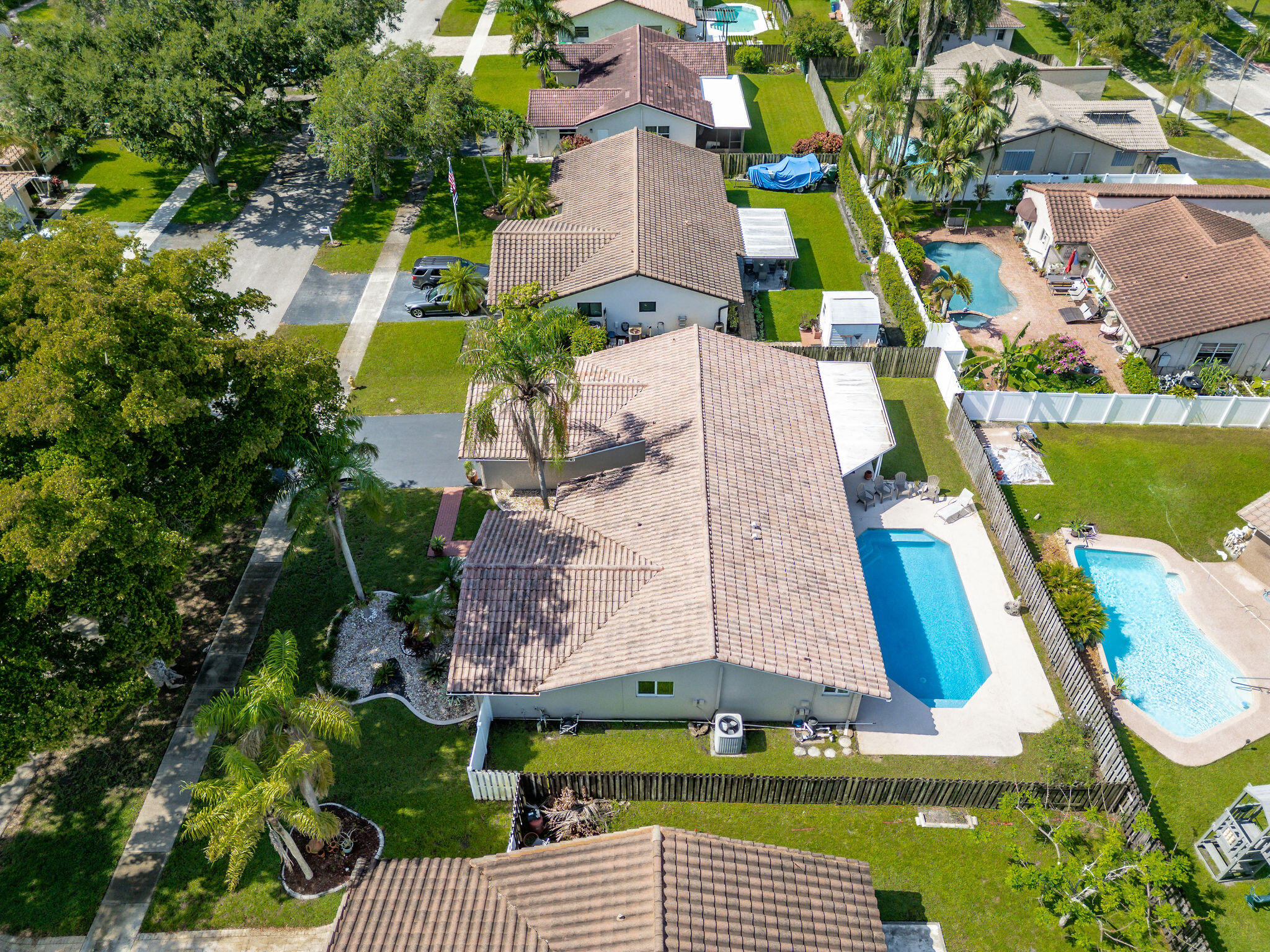 Welcome to this charming single-story residence in Cooper City's Forest Lake. This thoughtfully designed home offers just under 2,000 sq ft of living space, with four, stacked bedrooms, two full bathrooms and one half bath, boasting hurricane-impact windows/doors, and a newly remodeled cabana bath, opening out to the private Diamond Brite pool, open patio and fenced-in yard. The open floor plan maximizes comfort & functionality, featuring a bonus family room off the kitchen, while the two-car garage provides convenient, secure parking & plenty of room for storage.  Situated off the beaten path, yet just a two-minute walk to Forest Lake Park for volleyball, tennis, pickle ball or an evening walk, and only minutes away from Cooper City's excellent schools, small-town shopping & local dining. Roof Inspection Report attached.