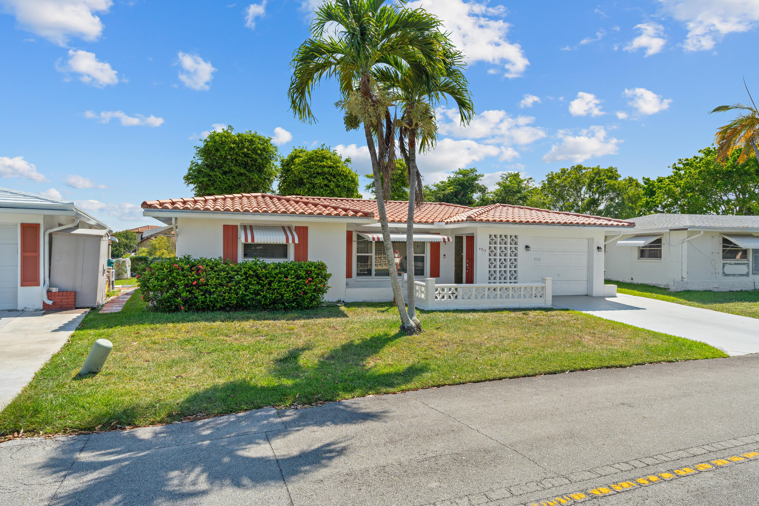 Must See!  Meticulous 1,600 sq. ft. 2 bed 2 bath home in the 55+ Mainlands community features an extra- large family room with water views and gentle breezes. The true centerpiece is the wall-to-wall patio windows that frame breathtaking views of the scenic trees, foilage and calming water vistas. A seamless blend of the interior and outdoors. The expansive family room has custom-built-in cabinetry, built-in surround sound entertainment system. The inviting kitchen includes updated cabinetry, custom countertops/ SS appliances. Eat-in kitchen includes built-in cabinetry. Laminate wood floor, tile, impact windows. Newer AC, Water Heater, Electrical. Enjoy the clubhouse social groups/activities/two large pools. Great location near golf courses, beaches and major turnpike roads. One owner 55+.