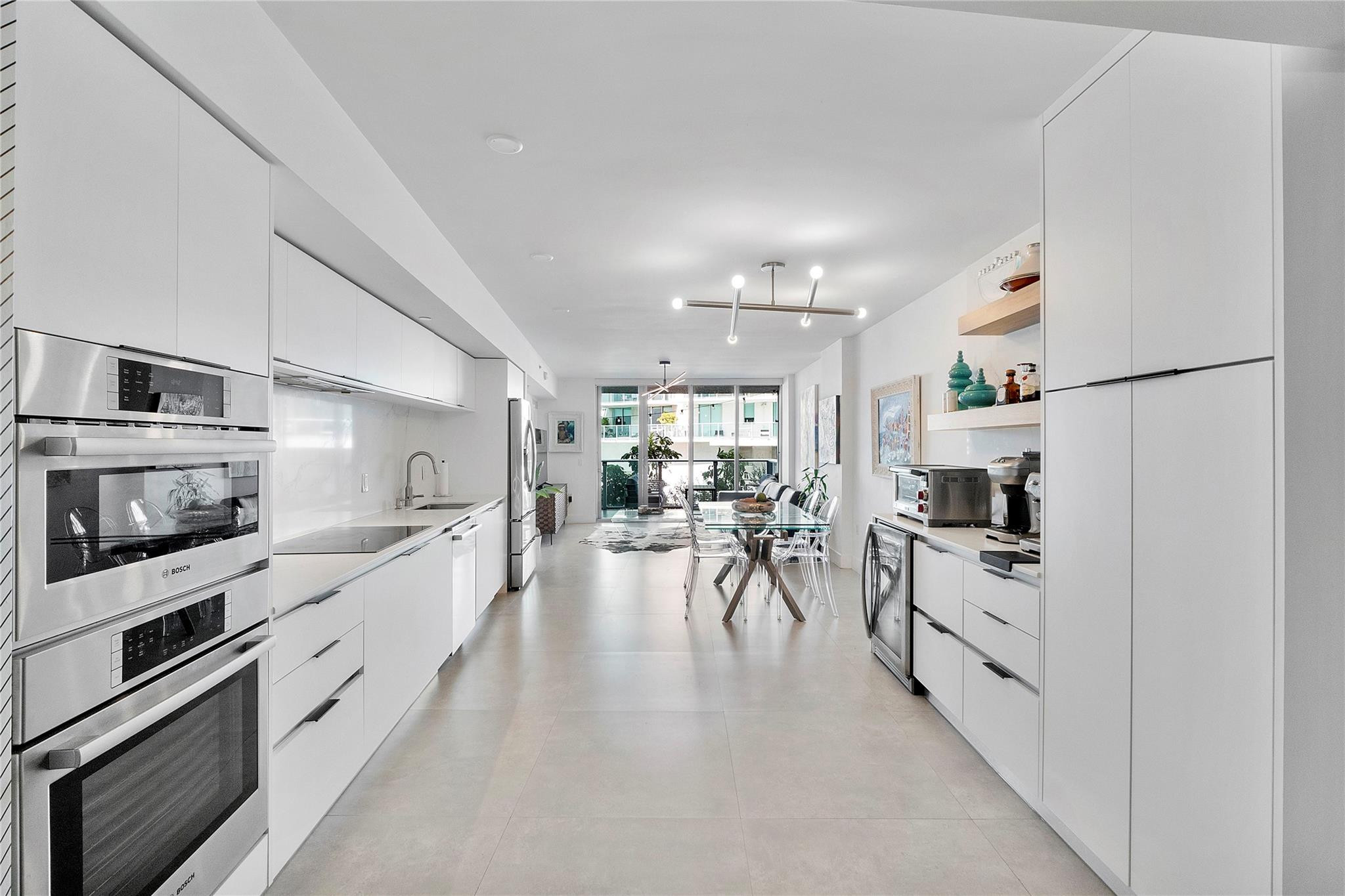 Experience the ultimate blend of elegance and coastal living in this spacious 2-bed, 2-bath condo at Peloro, a boutique Bayfront building in Miami Beach. Enjoy a bright, open layout with floor-to-ceiling glass and a remodeled kitchen featuring new appliances and a custom coffee corner with extra storage, perfect for your morning ritual. Peloro offers resort-style amenities including a bayfront pool and jacuzzi, fitness center, sauna, and 24-hour concierge. Steps from the beach, shopping, and dining, this property can be rented up to 12 times per year for a minimum of 30 days—ideal for investors or a second home. Live the Miami Beach lifestyle with luxury, flexibility, and an unbeatable location surrounded by water views and vibrant city energy.