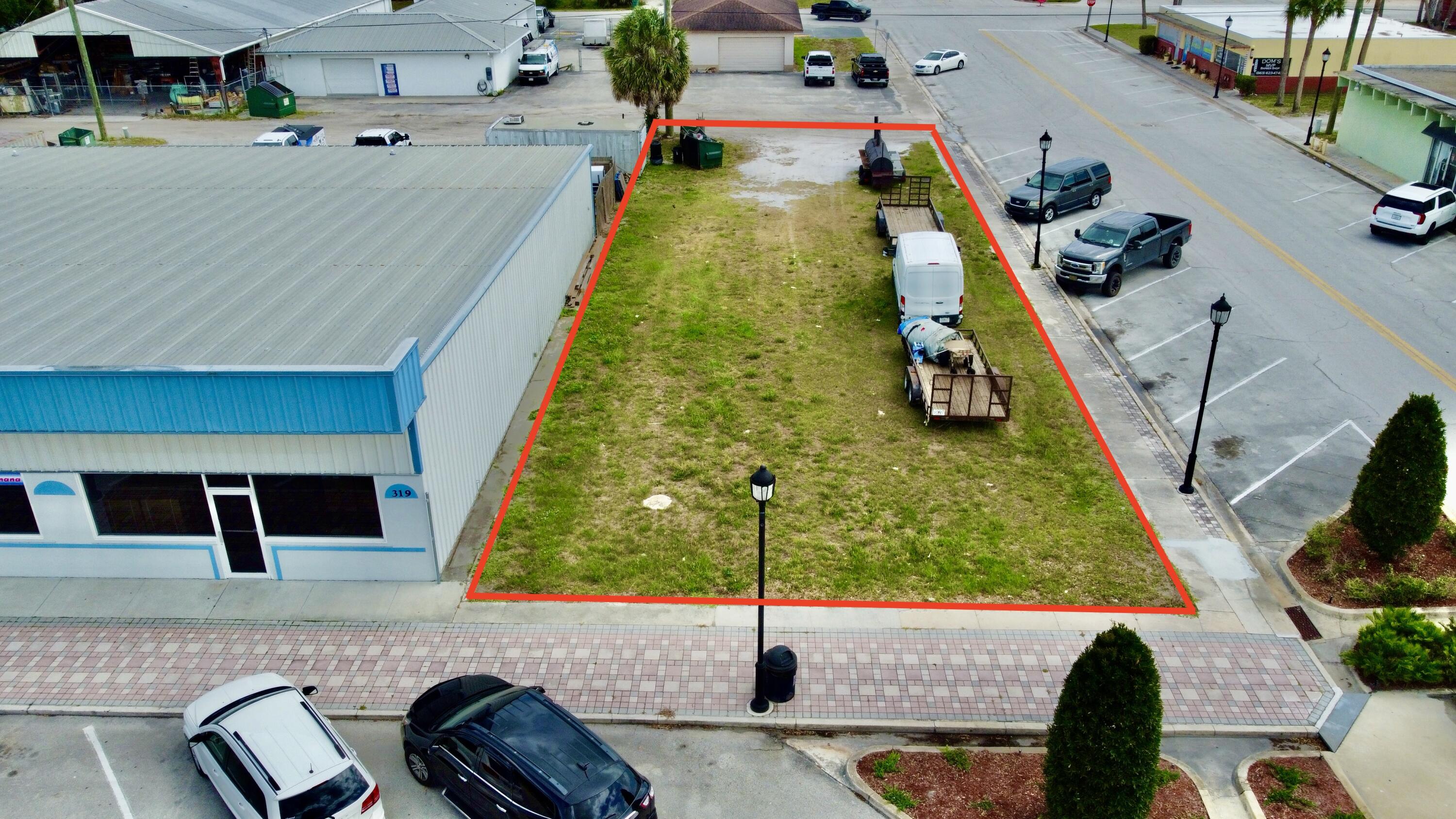 Prime Commercial Opportunity in the Heart of Okeechobee! Vacant commercial parcel ideally located just off the high-traffic intersection of SR 70 (24,500 daily traffic counts) and US Hwy 441 (32,500 daily traffic counts). The last available vacant land parcel on bustling Park Street, offering exceptional visibility, strong foot traffic, and proximity to major shopping destinations. Zoned for a wide range of uses, including professional, business, and medical offices; retail stores and services; restaurants, cafés, and take-out concepts; dry cleaners; laundries; private clubs; nightclubs; and bars. A rare investment and development opportunity in one of Okeechobee's most sought-after commercial corridors.  Bring your dreams and your plans and make it come to fruition!