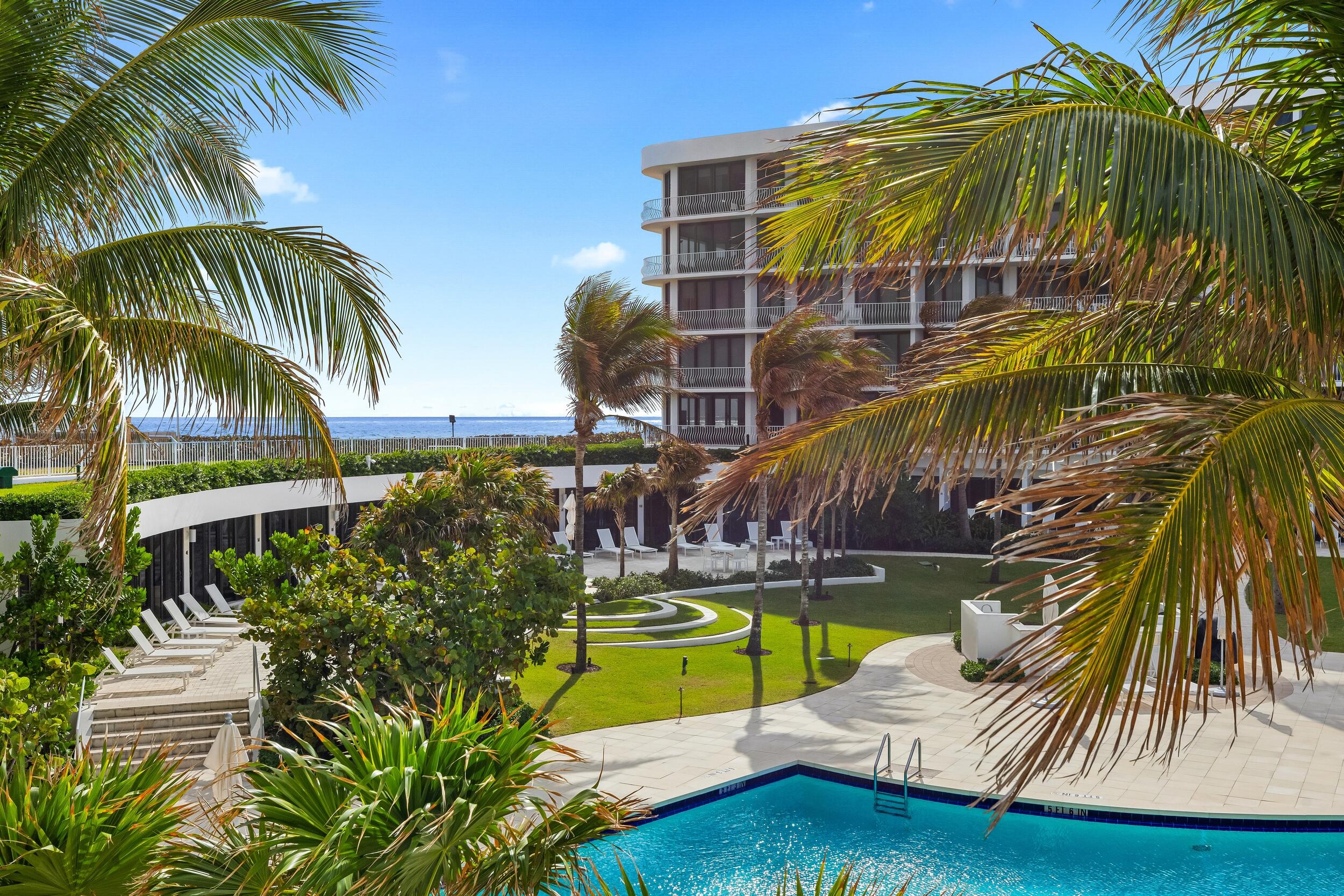 Fabulous Sloan's Curve condo with 2 bedrooms, 2 bathrooms, and powder room. This light filled, south-facing unit features a fantastic open floor plan and a large, covered balcony with beautiful views of the resort style pool area and peeks of the ocean. In addition to the serene views, the spacious balcony also features a spiral staircase that leads to the pool and beach access. Sun-soaked great room with wet bar is perfect for entertaining guests. Primary wing with dual walk-in closets, large bath, and dressing area that could double as an office. The full-service, oceanfront Sloan's Curve Condominium offers 24-hour security, full time manager, exercise facilities, tennis courts, beautiful pool area, and beach access for residents.