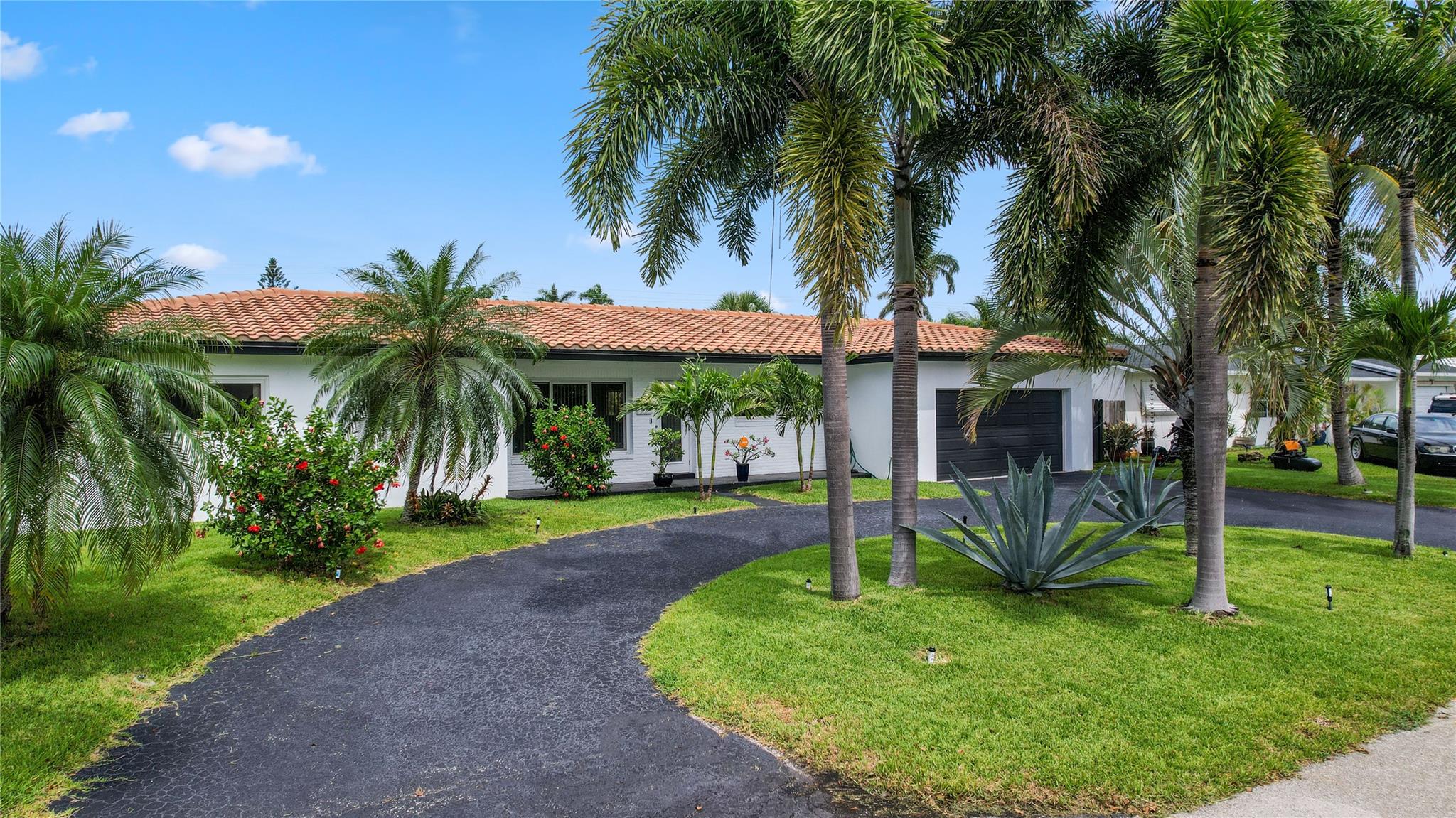 Situated in The Cove in Deerfield Beach, you will find this meticulous two-bedroom, two-and-a-half bathroom home with a pool/spa offering an amazing backyard oasis with new landscaping set up to provide you with the ultimate privacy. This home has a great modern curb appeal thanks to a newly painted exterior and landscaping, and this feeling continues inside the home with a freshly painted interior and new floors. While located on a peaceful cul-de-sac this home also provides newer appliances, an oversized two-car garage, a brand new pool heater, sprinkler/irrigation system, a Vivint security system, full windstorm protection, and plenty of room in the backyard for you to add your personal touches. No Hoa, perfect for your own personal retreat or as a vacation rental property.