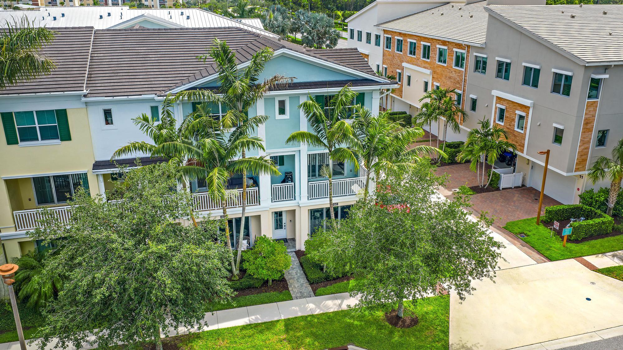 This upgraded end-unit townhome offers 3 bedrooms, 3.5 bathrooms, a den, and an unbeatable location within walking distance of Alton Town Center's shopping and dining. The open-concept floor plan is filled with natural light thanks to its eastern exposure and additional end-unit windows. The kitchen features natural gas cooking, double ovens, wood cabinetry, and a custom backsplash. Upstairs, the spacious primary suite includes custom dual closets and a beautifully finished bathroom with a large walk-in shower and soaking tub. Additional upgrades include motorized blinds and an extended patio deck. Offered fully furnished. Built with CBS construction and hurricane-impact glass.  Enjoy Alton's resort-style amenities, including a clubhouse, fitness center, pickleball,  tennis and basketball courts, lap pool, spa, and more.