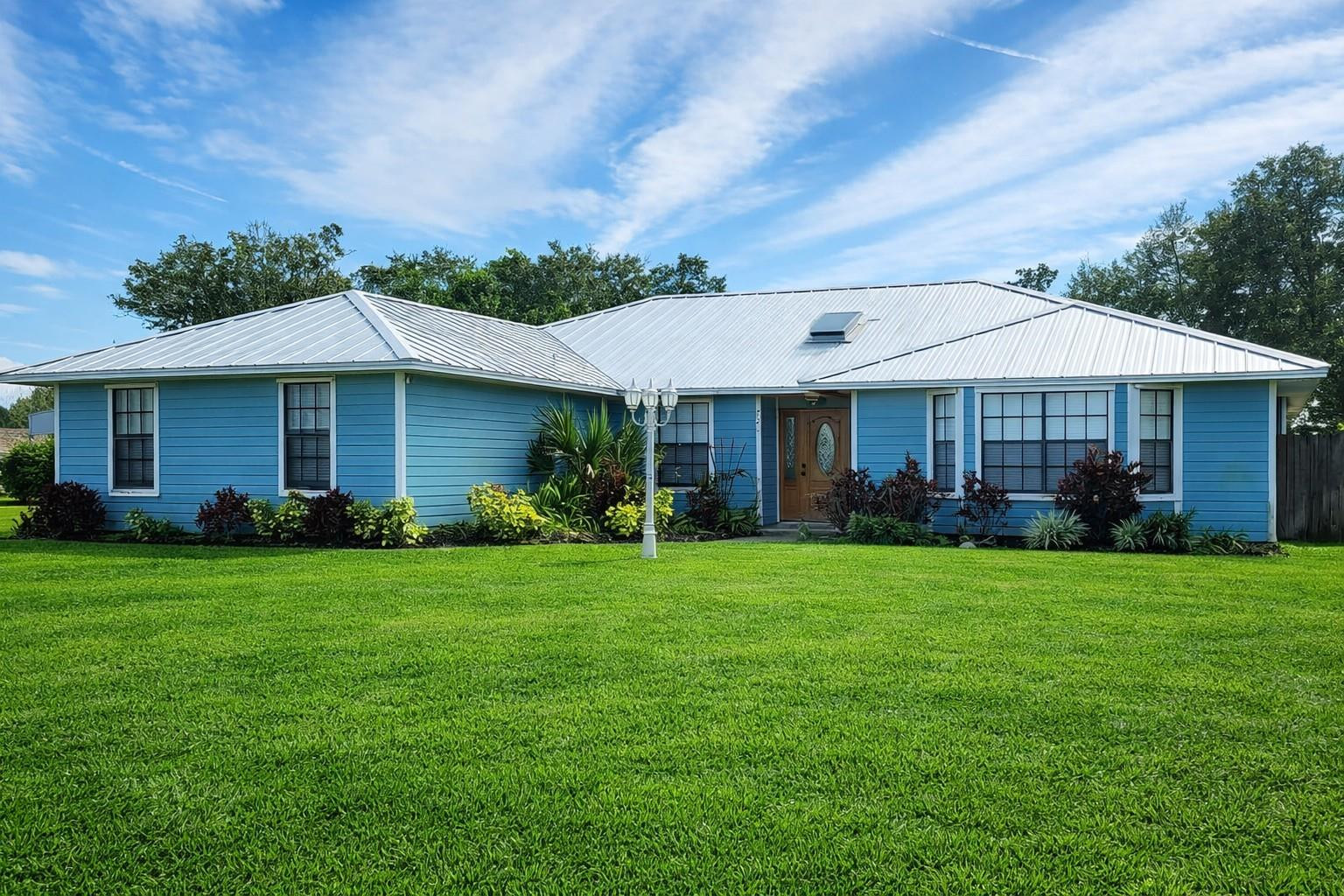 This beautifully maintained 3-bedroom, 3-bath residence is ideally situated on a spacious corner lot within a sought-after private subdivision, just minutes from the ocean and Intracoastal. Enjoy close proximity to waterfront dining, live music, and some of Florida’s finest fishing in Sebastian.The home features a newly renovated kitchen designed for both function and style, complete with granite countertops, stainless steel appliances, a center island with gas cooktop, and an impressive 5.5’ x 10’ walk-in butler’s pantry accessed through dual pocket doors. A reverse osmosis water filtration system is conveniently located for easy access. The open family room and kitchen area offer vaulted ceilings and tile flooring throughout most of the home. A dedicated theater room includes built-in cabinetry, surround sound, bar area, and cove lighting for comfortable, low-glare movement.Step outside to a screened pool and spa with an expansive covered entertainment area featuring a pool table and full bath. The backyard also offers a separate shed, pump room, outdoor restroom, and 50-amp power with water hookups for two RVs.Additional highlights include a heavy metal roof (installed 2021, 30-year warranty), A/C system (2018), water heater (2014, elevated and well-maintained), and recently installed whole-house solar panels. Current homeowner’s insurance is approximately $4,134 annually.This property combines lifestyle, efficiency, and location in one exceptional offering.