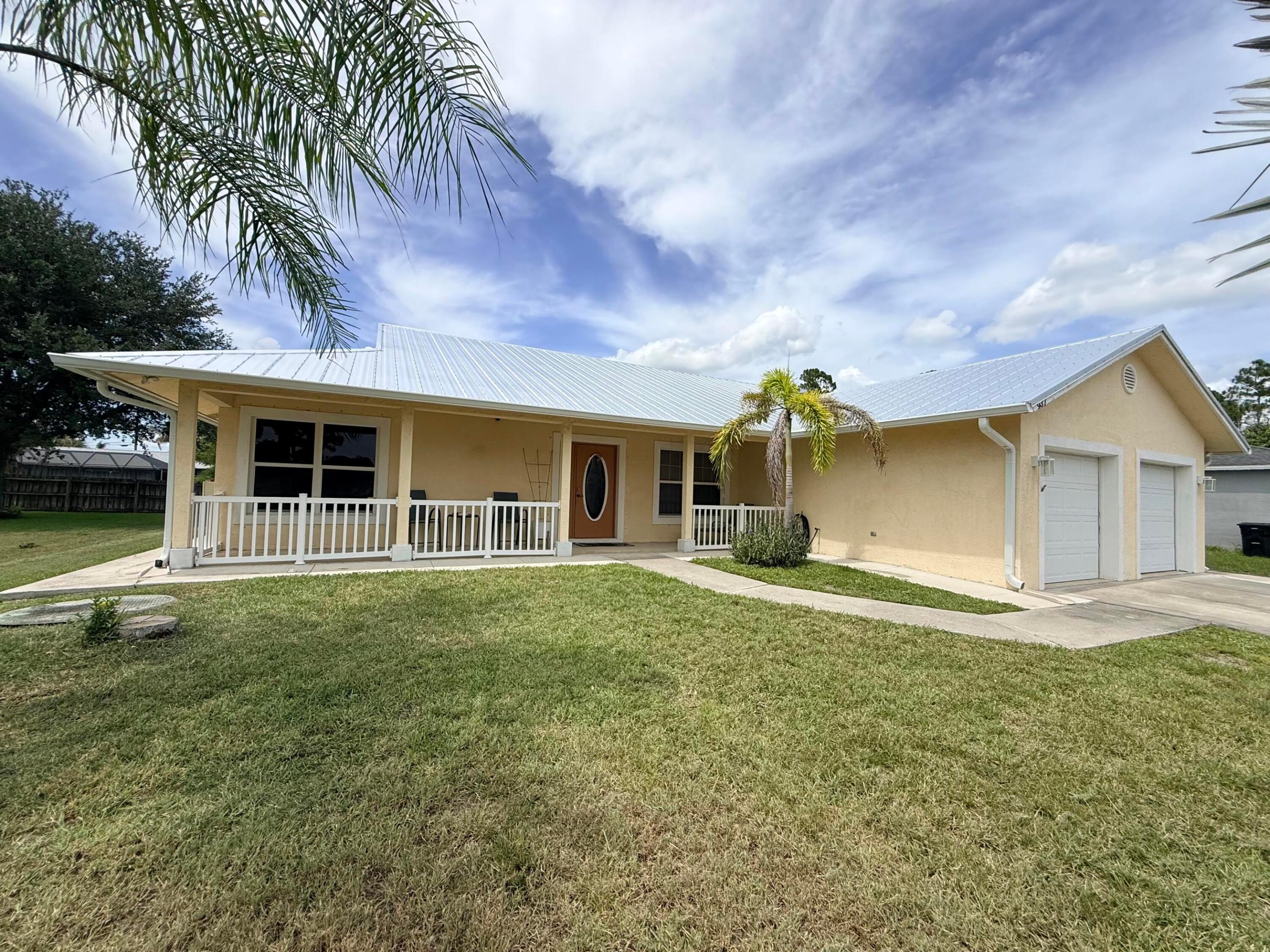 Aggressively priced for a quick sale at the seller's request, this home offers exceptional value in today's market—don't miss this opportunity.  Welcome to this charming, no HOA fees or restrictions, single-story home in Port St. Lucie featuring 3 bedrooms, 2 bathrooms, and 1,656 square feet of comfortable living space. Recent updates include a brand-new metal roof with gutters, with fresh exterior paint coming soon for added curb appeal.  The functional, open layout is ideal for everyday living, while the attached two-car garage provides ample parking and storage. Conveniently located in an established Port St. Lucie neighborhood, this home offers the perfect combination of comfort, value, and accessibility.  Schedule your private showing today before it's gone.