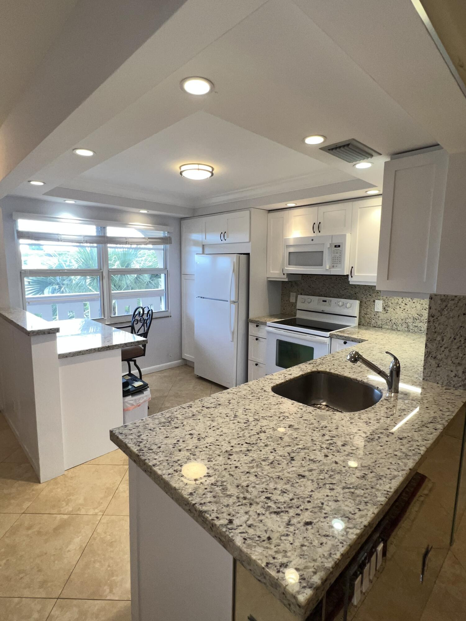 Beautiful Lake & Fountain View, 2 Bed / 2 Bath, Substantially Remodeled, Tile Floors, Granite and Quartz Countertops, Wood Cabinets, Plenty of Storage, New Balcony Windows, Freshly Painted. Pride of Ownership Really Shows In This Wynmoor Gem! Enjoy Golf, Tennis, Pickleball, Multiple Pools, A Picnic - BBQ Area. And So Much More. Your New Home Is Waiting!