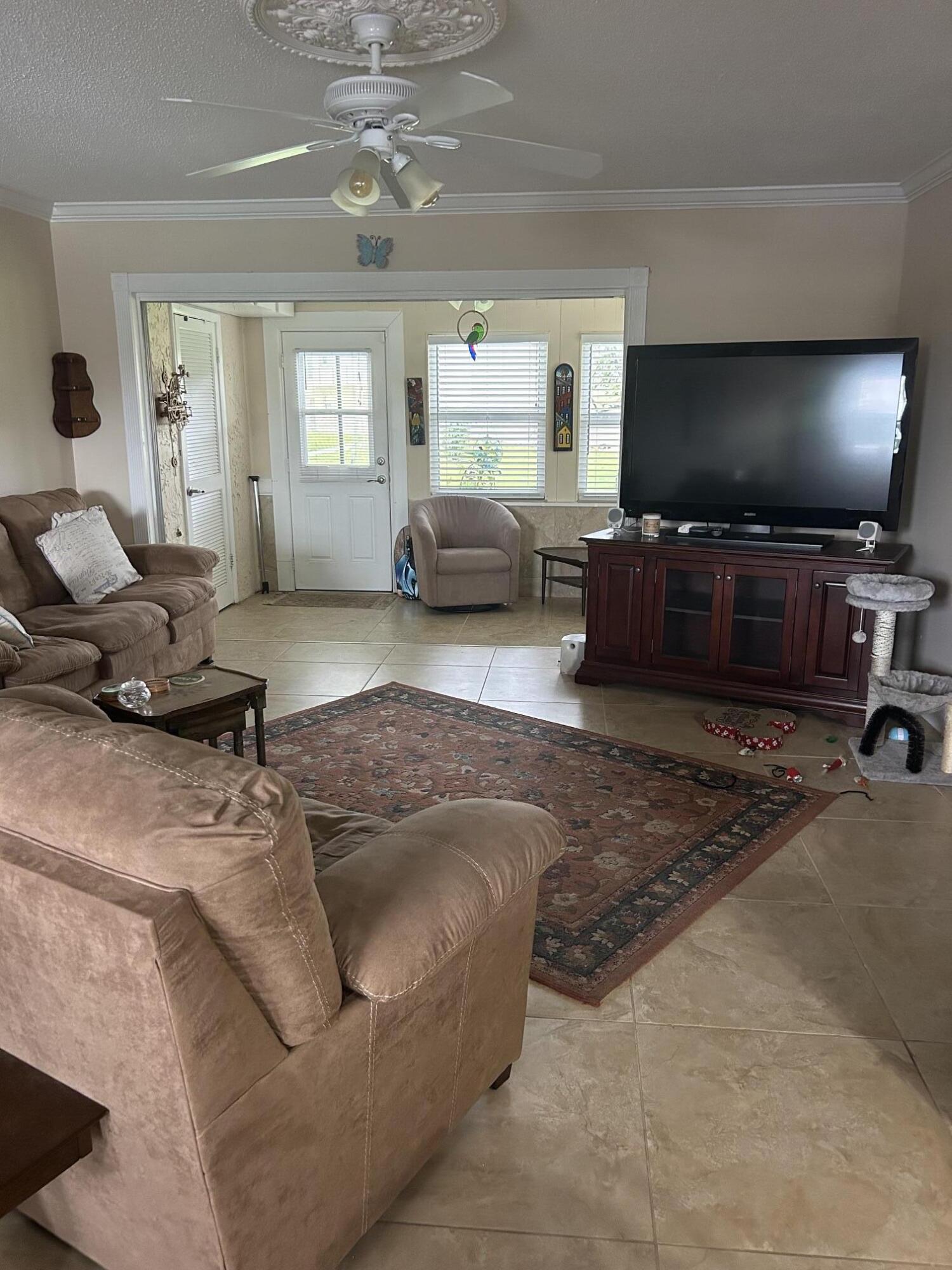Spacious first floor 1 bedroom 1 bath plus Den Unit in over 55  community with NEW ROOF, updated kitchen and baths.  A/C enclosed patio which is a perfect spot for morning coffee or an evening cocktails.  Parking spot in front of unit plus lots of guest parking available Amenities include pool, fitness center, game room and more. Located minutes to shopping ,restaurants, beaches and PBI Airport