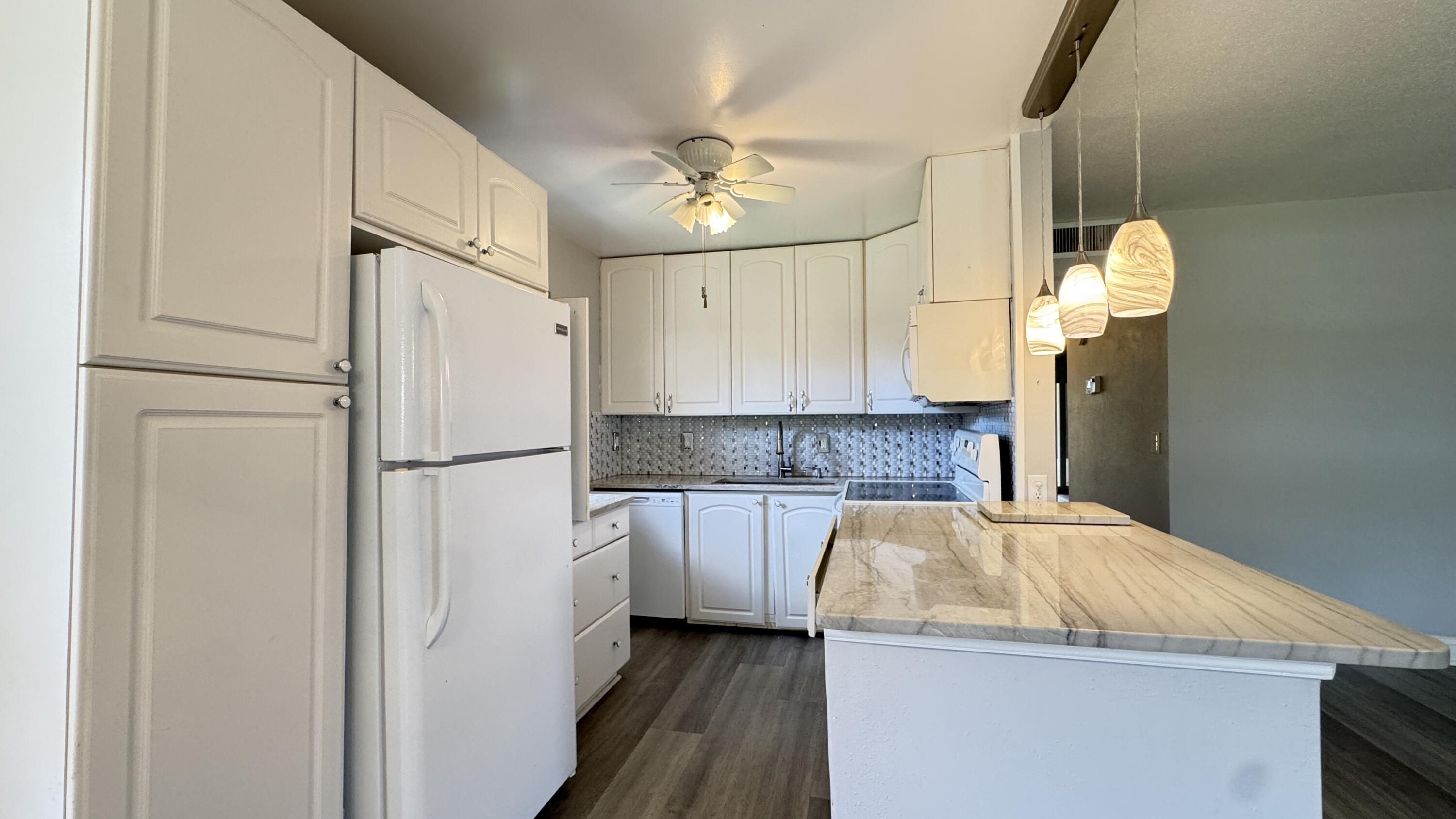 Beautifully maintained 2-bed, 2-bath condo in the highly sought-after Kings Point community of Delray Beach. This light and bright unit features a spacious open living and dining area, updated flooring, and a split-bedroom layout for added privacy. The updated kitchen offers modern finishes, ample cabinetry, and great functionality for everyday living. The primary includes generous closet space. Enjoy beautiful sunset lake views from the screened-in patio, perfect for relaxing or entertaining. Highlights include in-unit laundry convenience. Kings Point is a gated 55+ community with resort-style amenities all within walking of the unit including golf, pools, clubhouse, fitness center, pickleball, theater, and shuttle service. Just minutes to downtown Delray and the beach!
